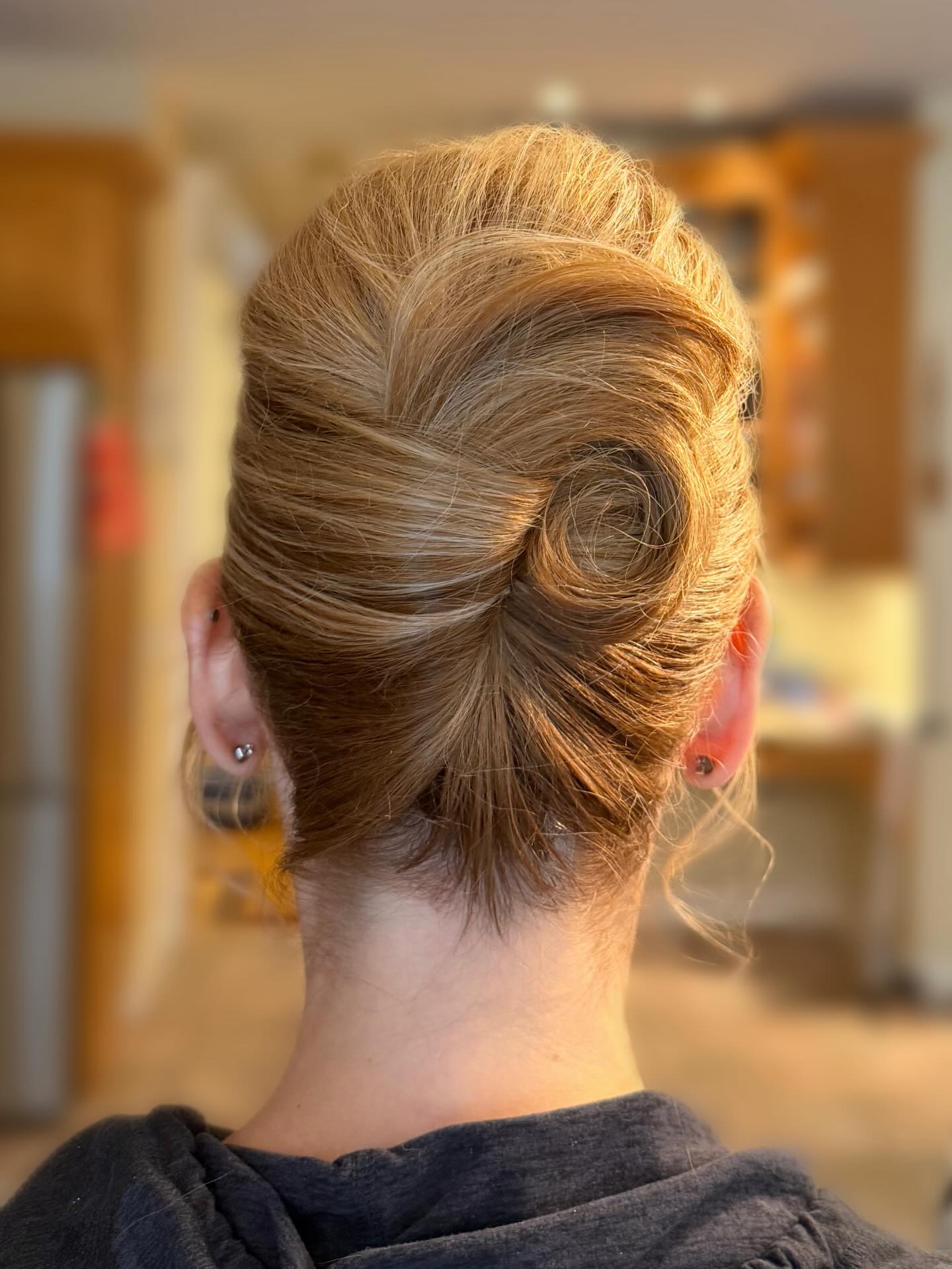 Off-Center Rolled French Twist with Polished Crown
