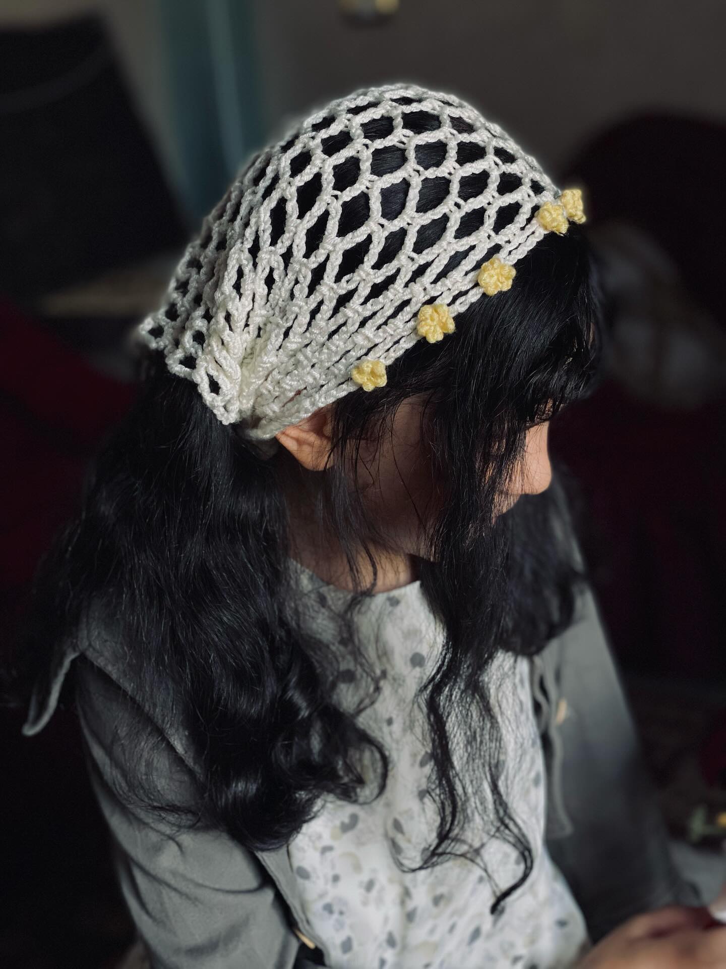 Open-Knit Crochet Snood with Tiny Yellow Daisies over Natural Black Waves