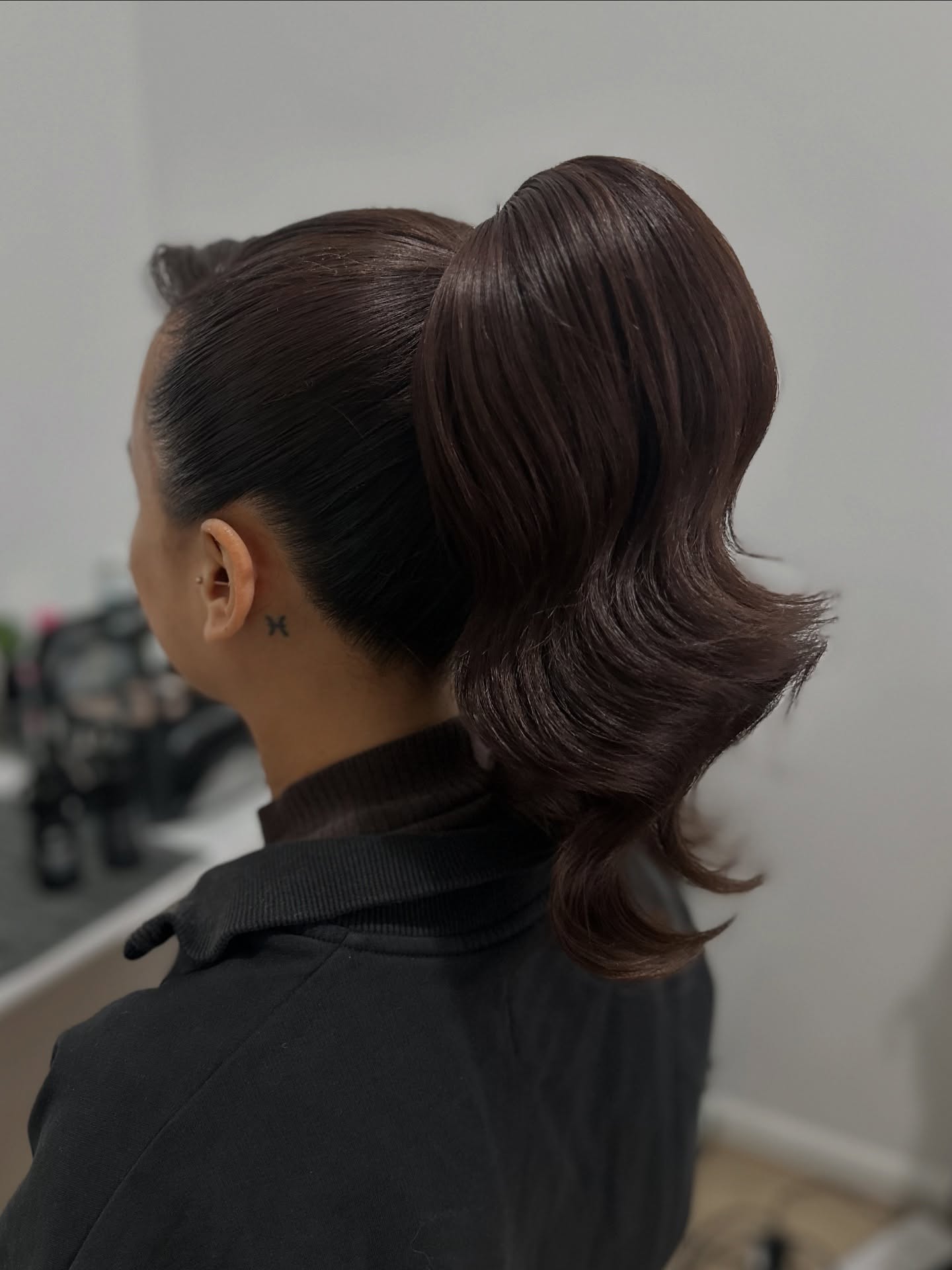 Polished Sculpted High Ponytail with Flared S-Wave Tail