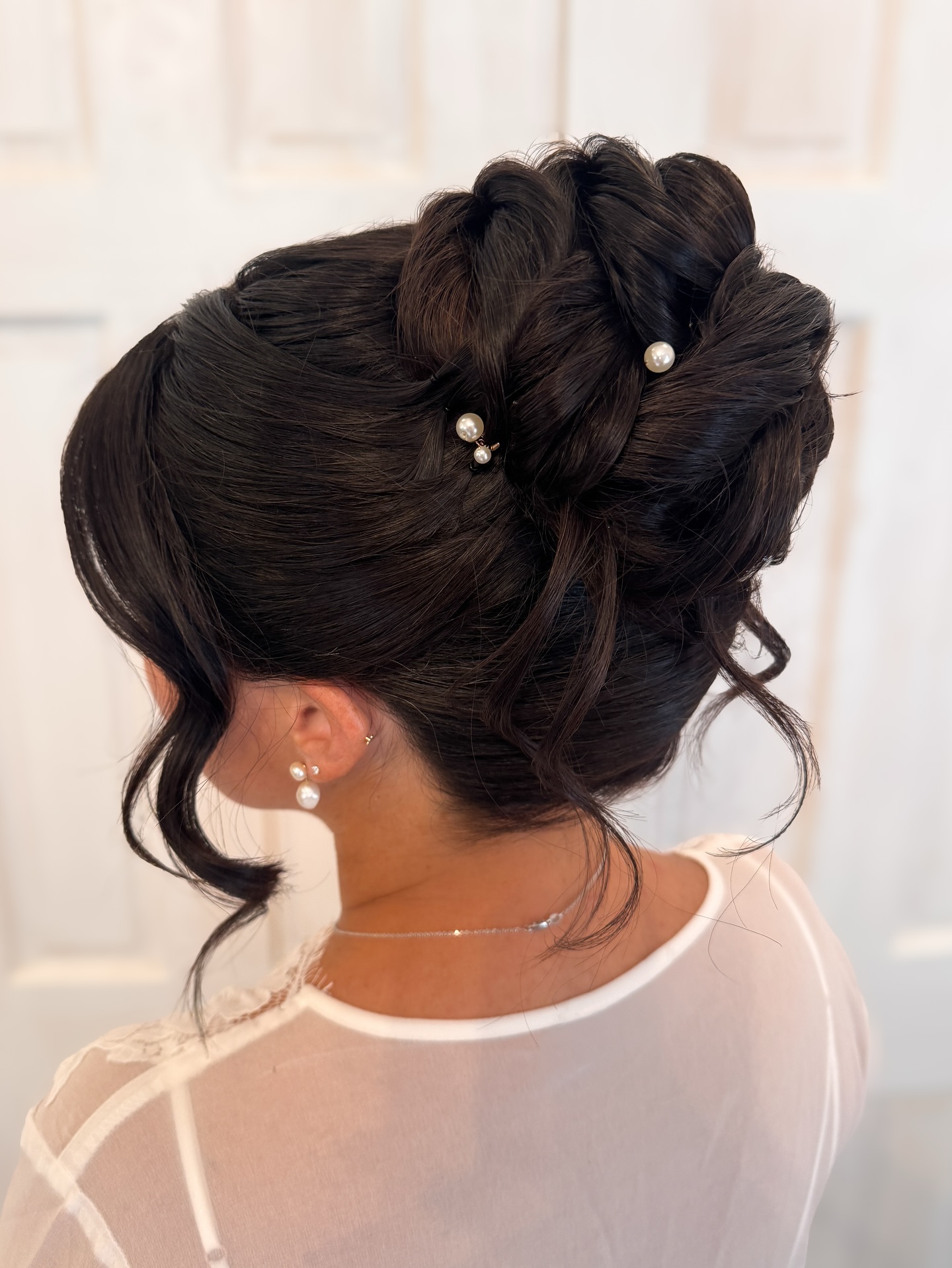 Polished Twisted High Bun with Pearl Accents