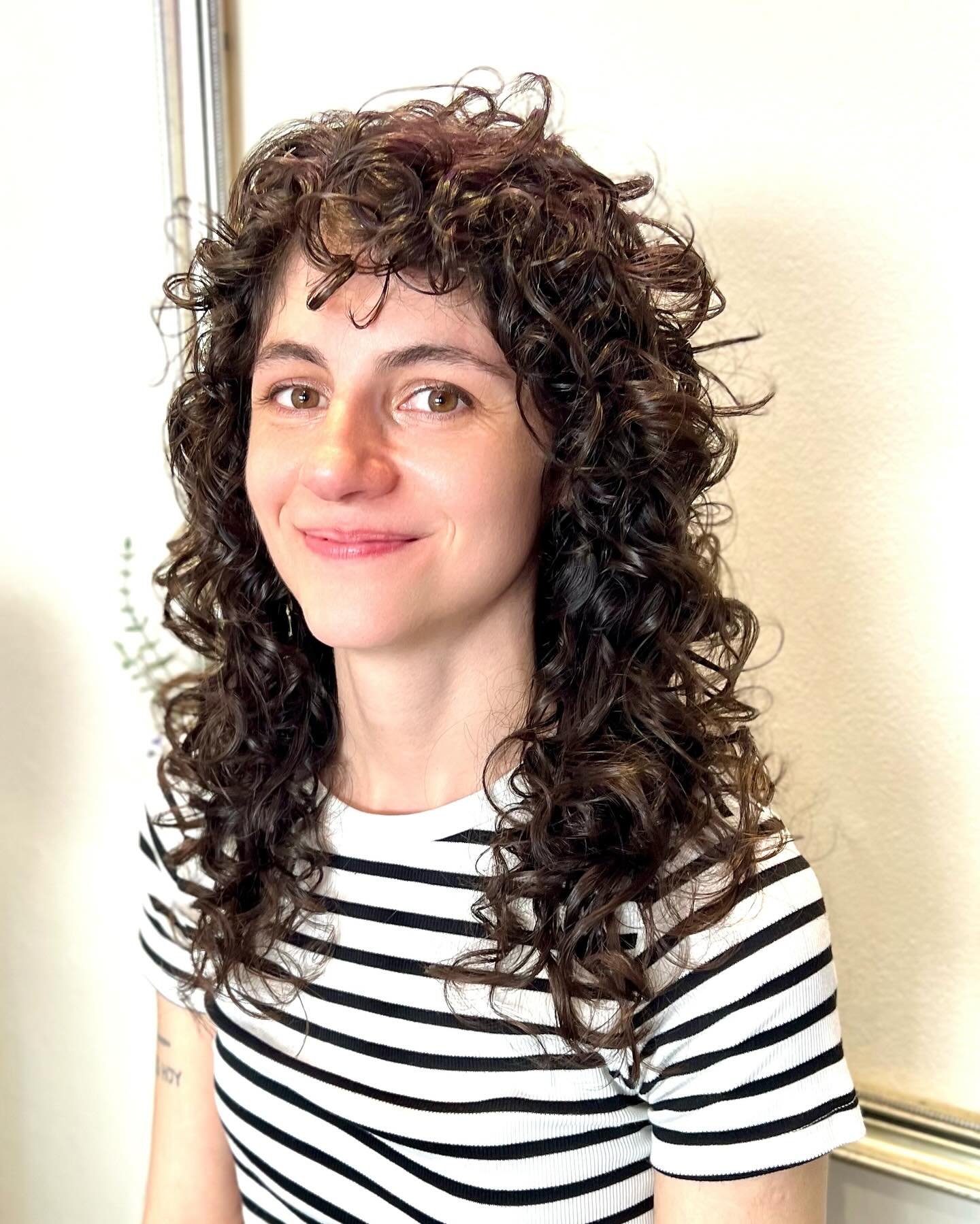 Ringlet-Textured Mid-Length Shag with Short Curly Fringe