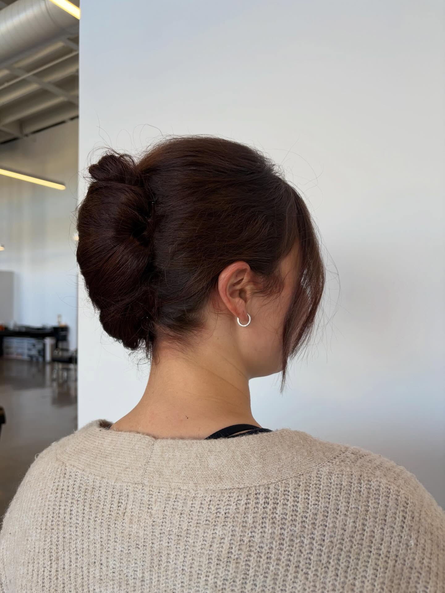 Rolled Twisted Low Bun with Blunted Curtain Panels