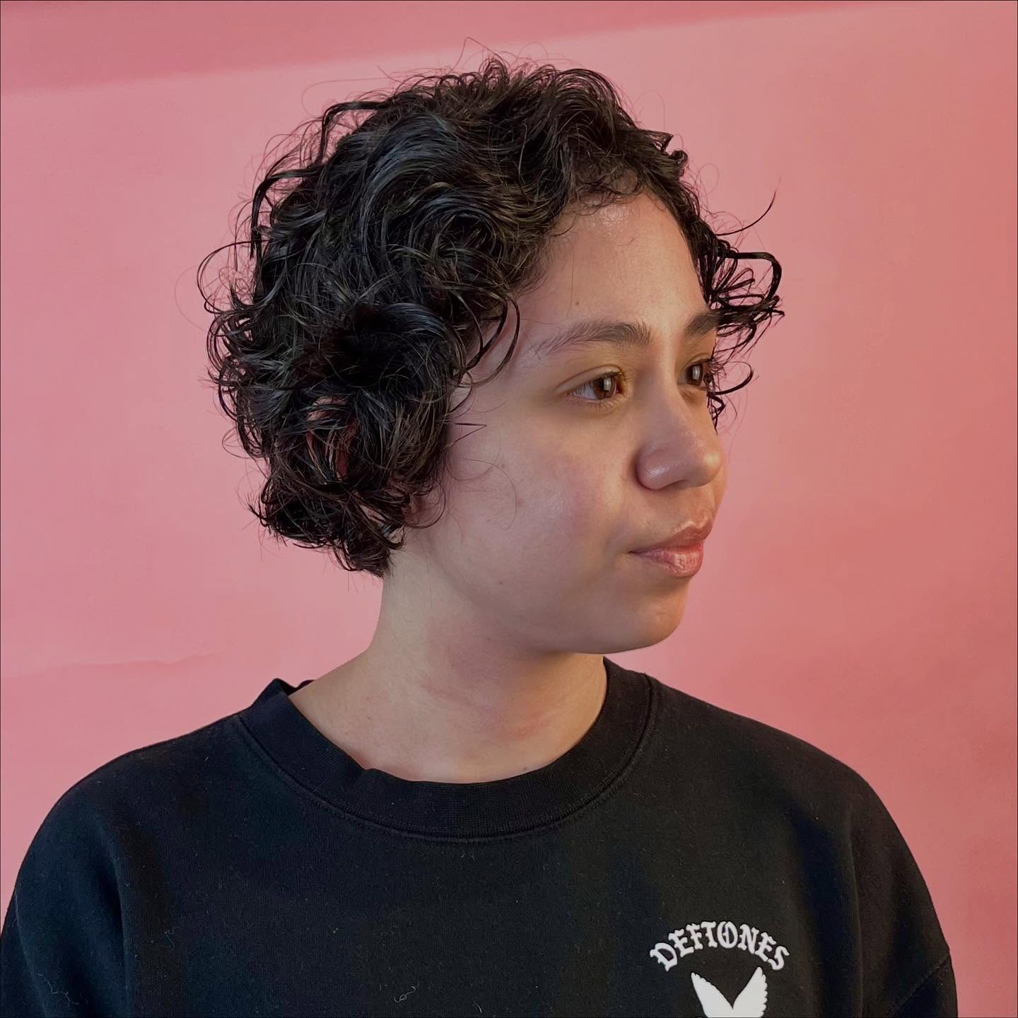 Short Curly Finger-Coil Pixie with Tapered Nape