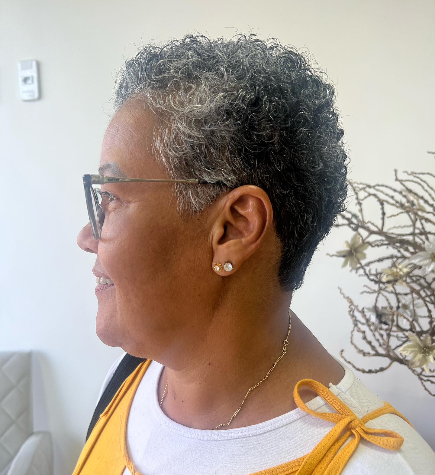 Short Curly Tapered Pixie with Natural Gray Highlights