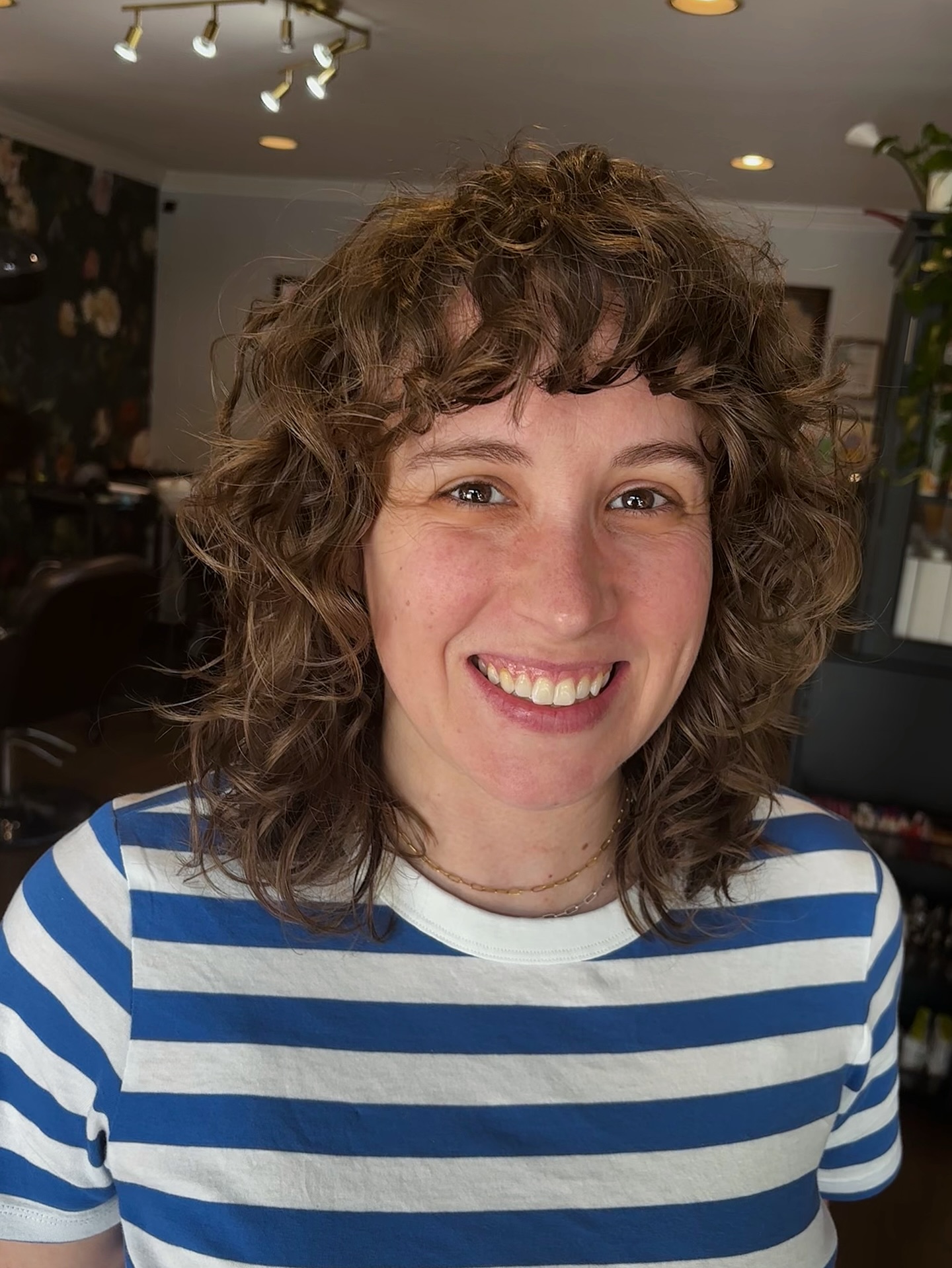 Shoulder-Length Curly Shag with Short Cropped Fringe