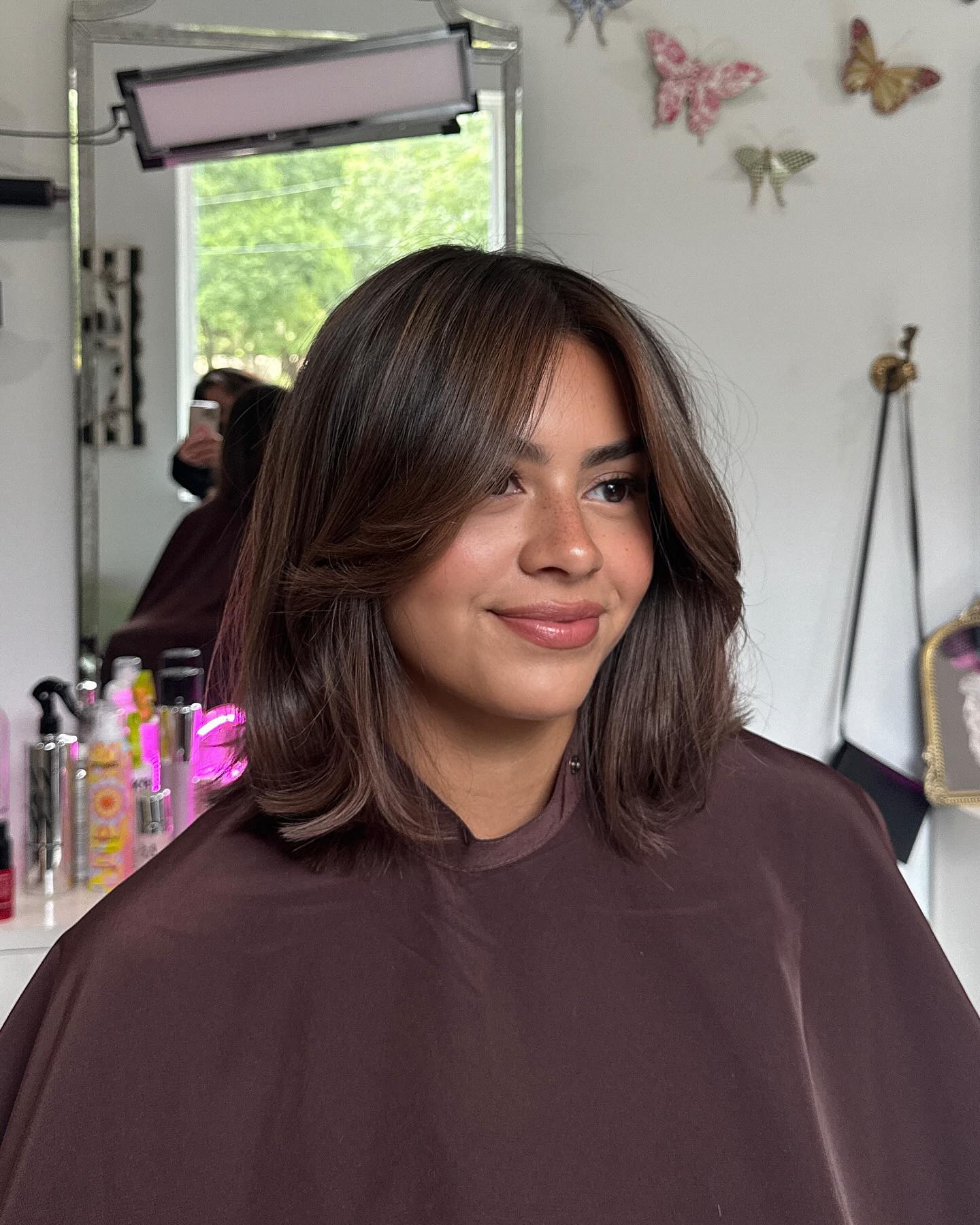 Shoulder-Length Feathered Layers with Flipped Under Ends