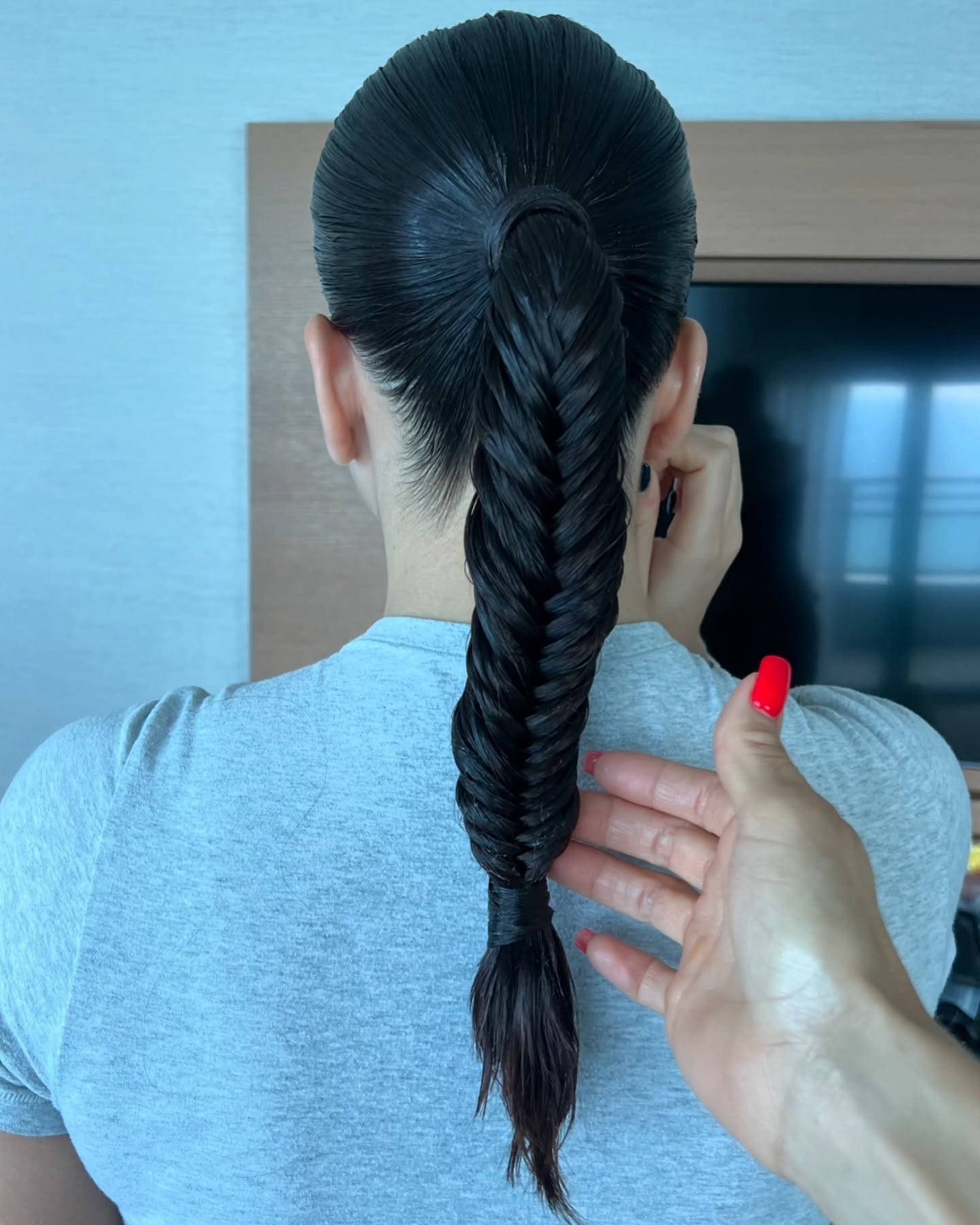 Sleek Centered Fishtail Pony with Hair-Wrap Finish