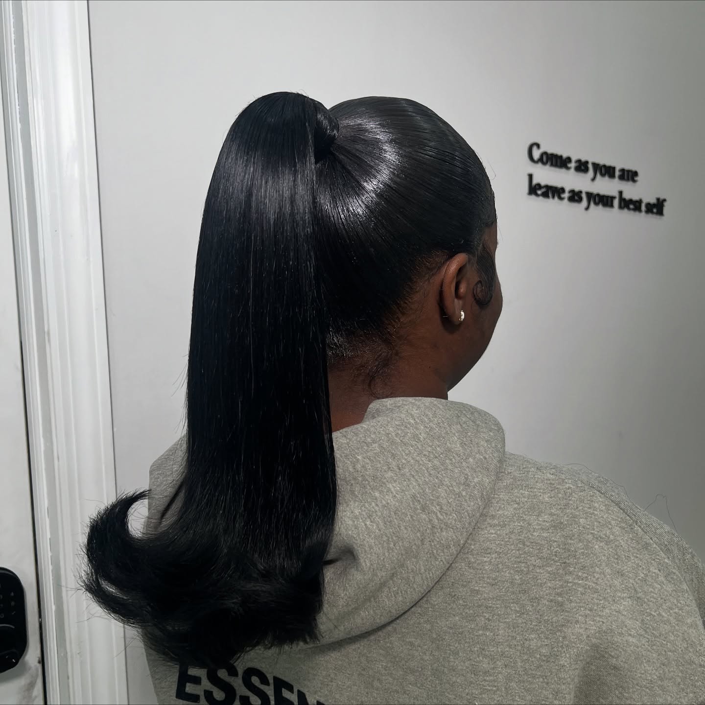 Sleek High Wrapped Ponytail with Flipped-Under Ends