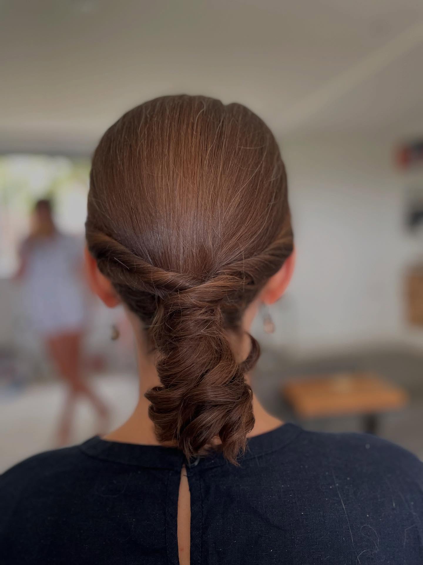 Sleek Low Twisted Rope Bun with Smooth Crown