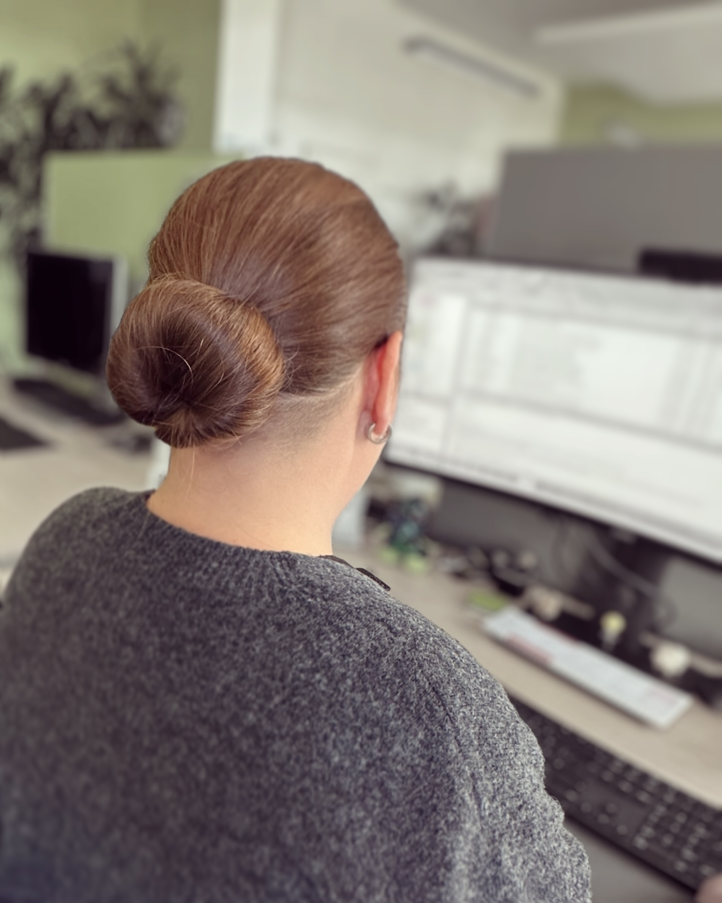 Sleek Low Wrapped Donut Bun with Precise Nape Taper