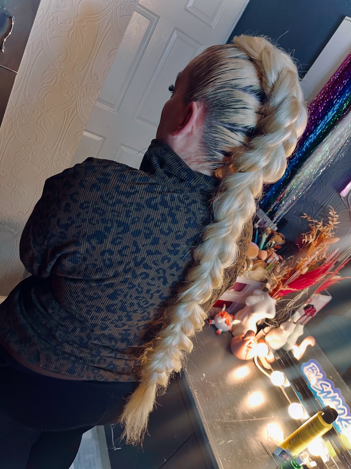 Sleek Platinum High Pony with Padded Dutch Braid and Root Shadow
