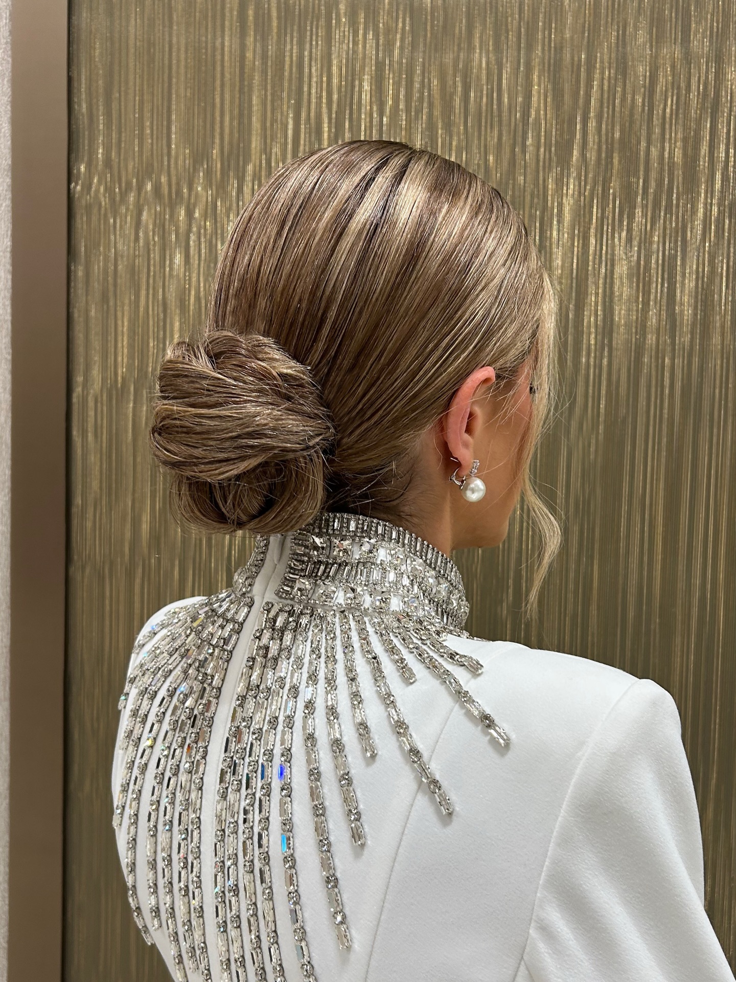 Sleek Rope-Twist Low Bun with Ash-Beige Babylights