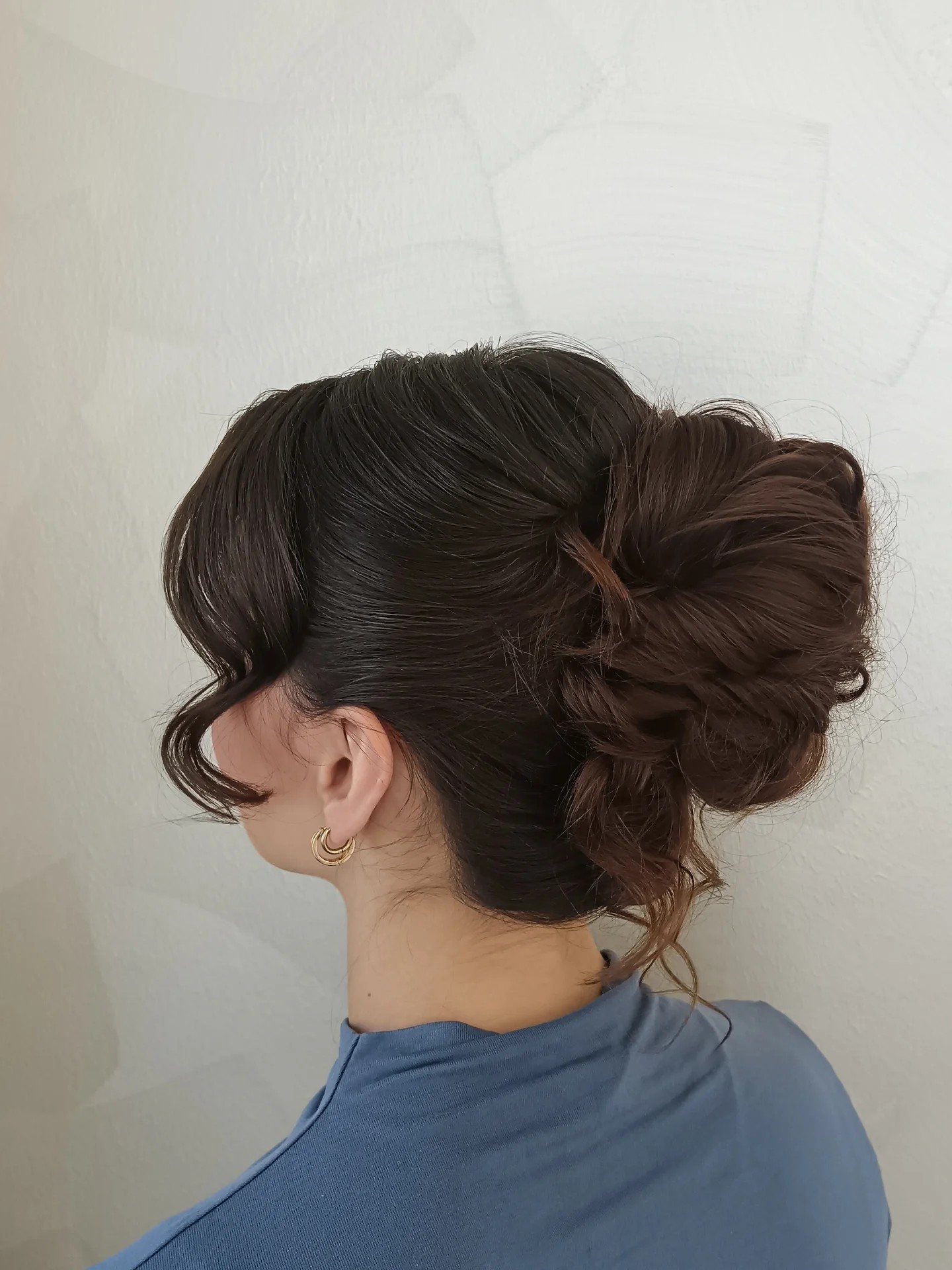 Sleek Side-Swept Updo with Textured Low Chignon