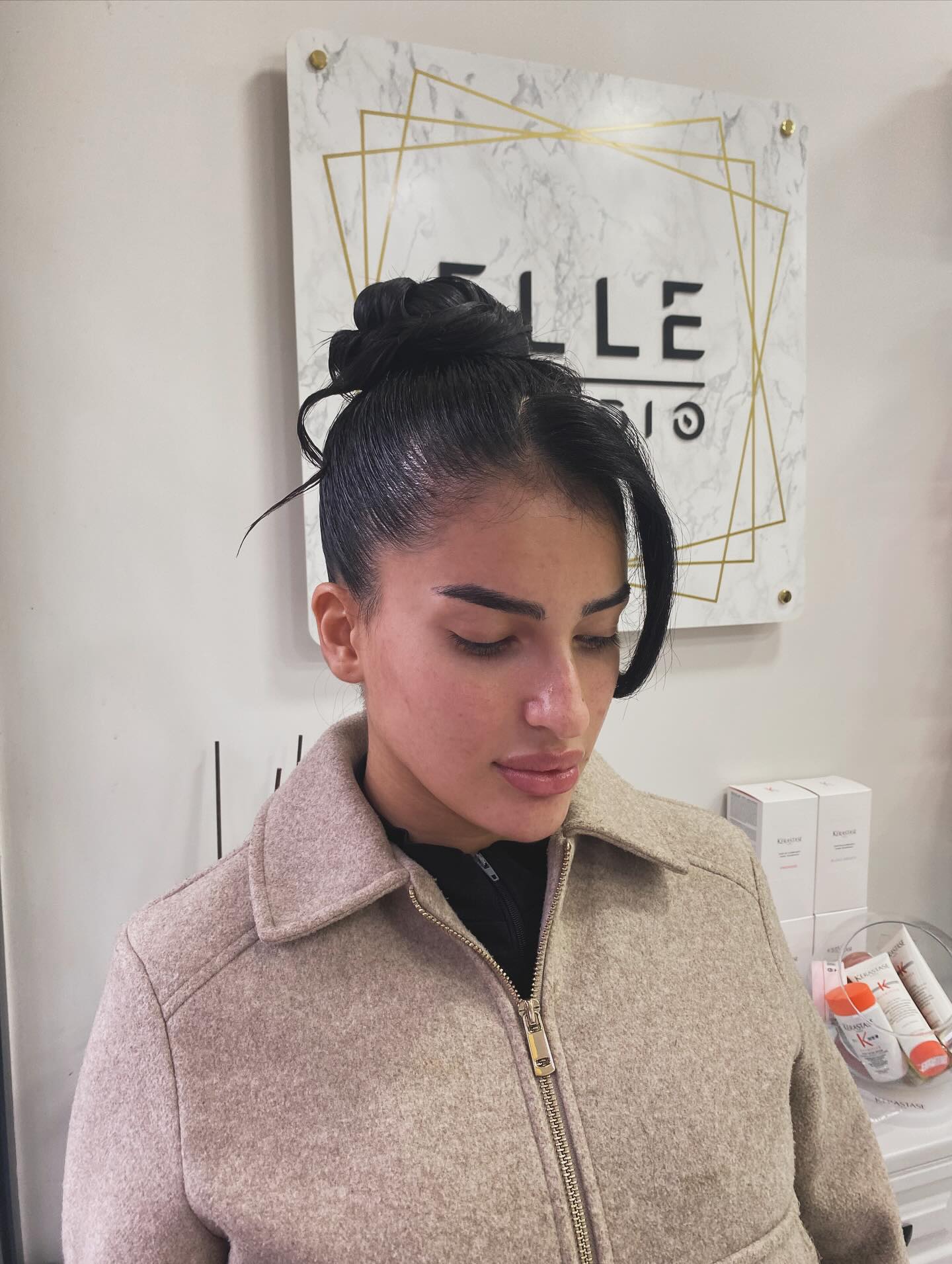 Sleek Twisted Topknot with Face-Framing Ribbon
