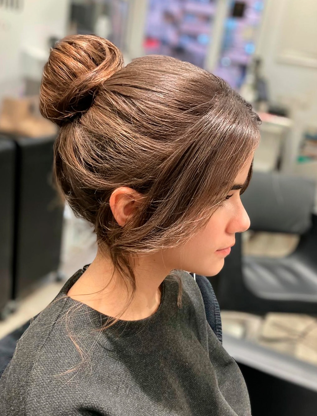 Sleek Wrapped High Bun with Soft Curtain Face-Framing