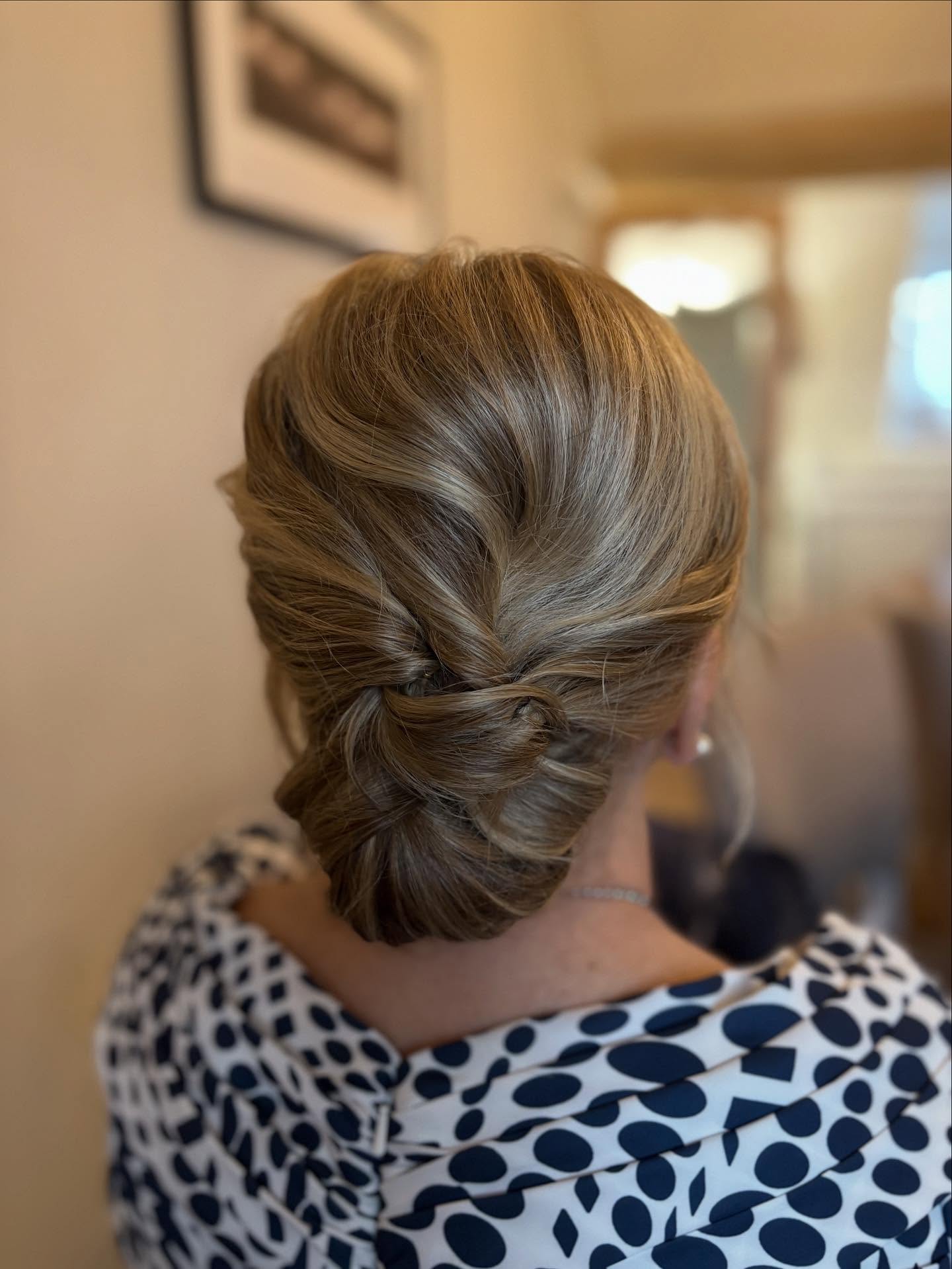 Soft Ash-Bronde Low Chignon with Interlaced Knot