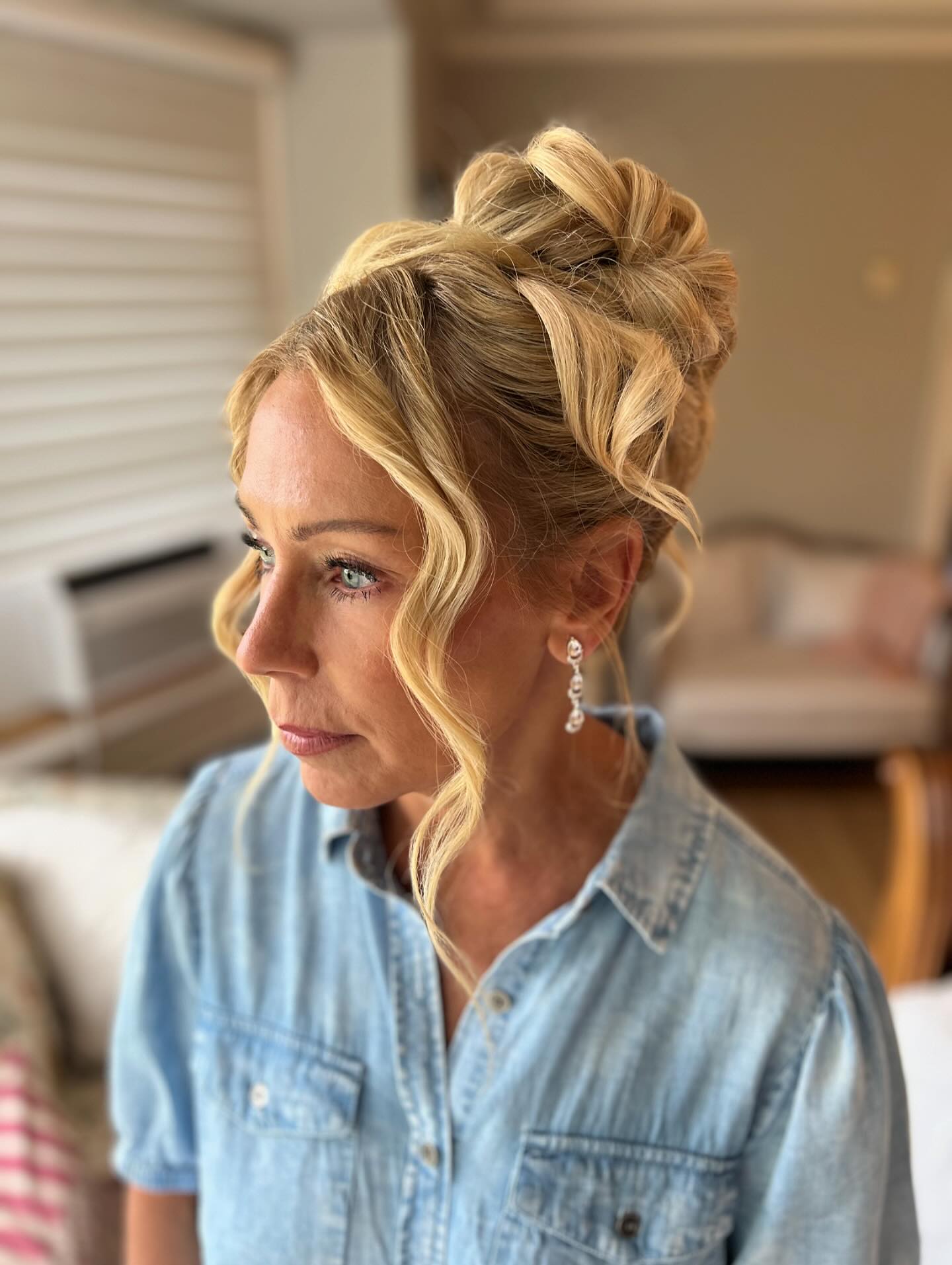 Soft Blonde Pin-Loop High Updo with Face-Framing Tendrils