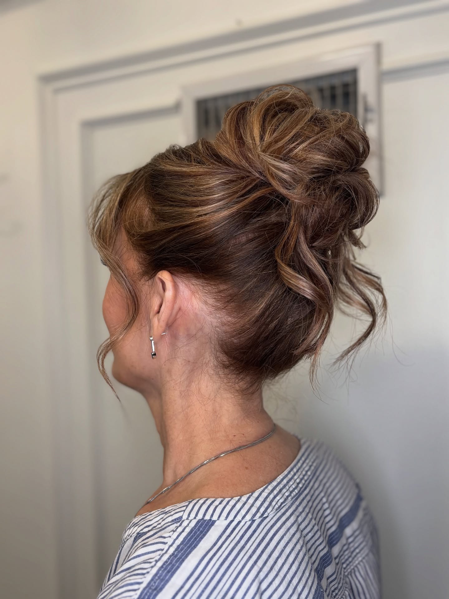 Soft Caramel-Painted Volume Updo with Face-Framing Tendrils
