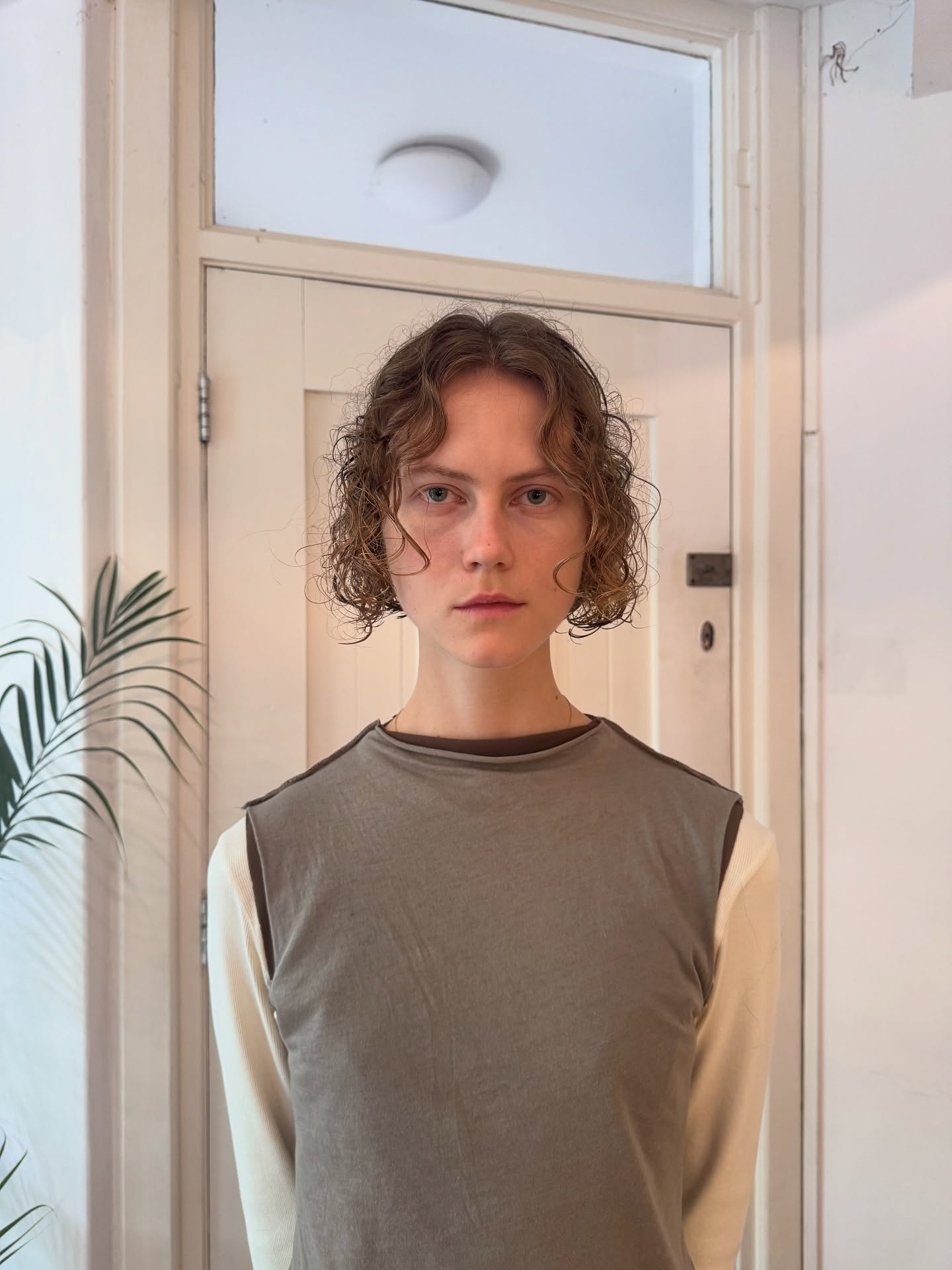 Soft Chin-Length Curly Bob with Face-Framing Curtain Curls