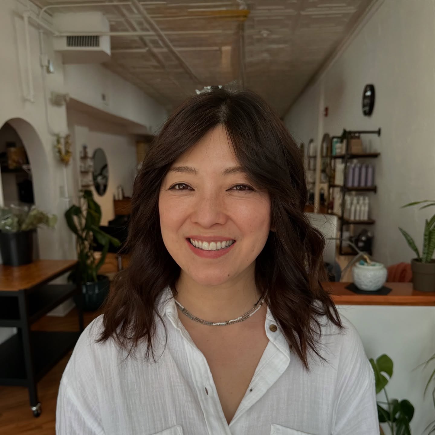 Soft Face-Framing Dark Brown Lob with Curtain Fringe