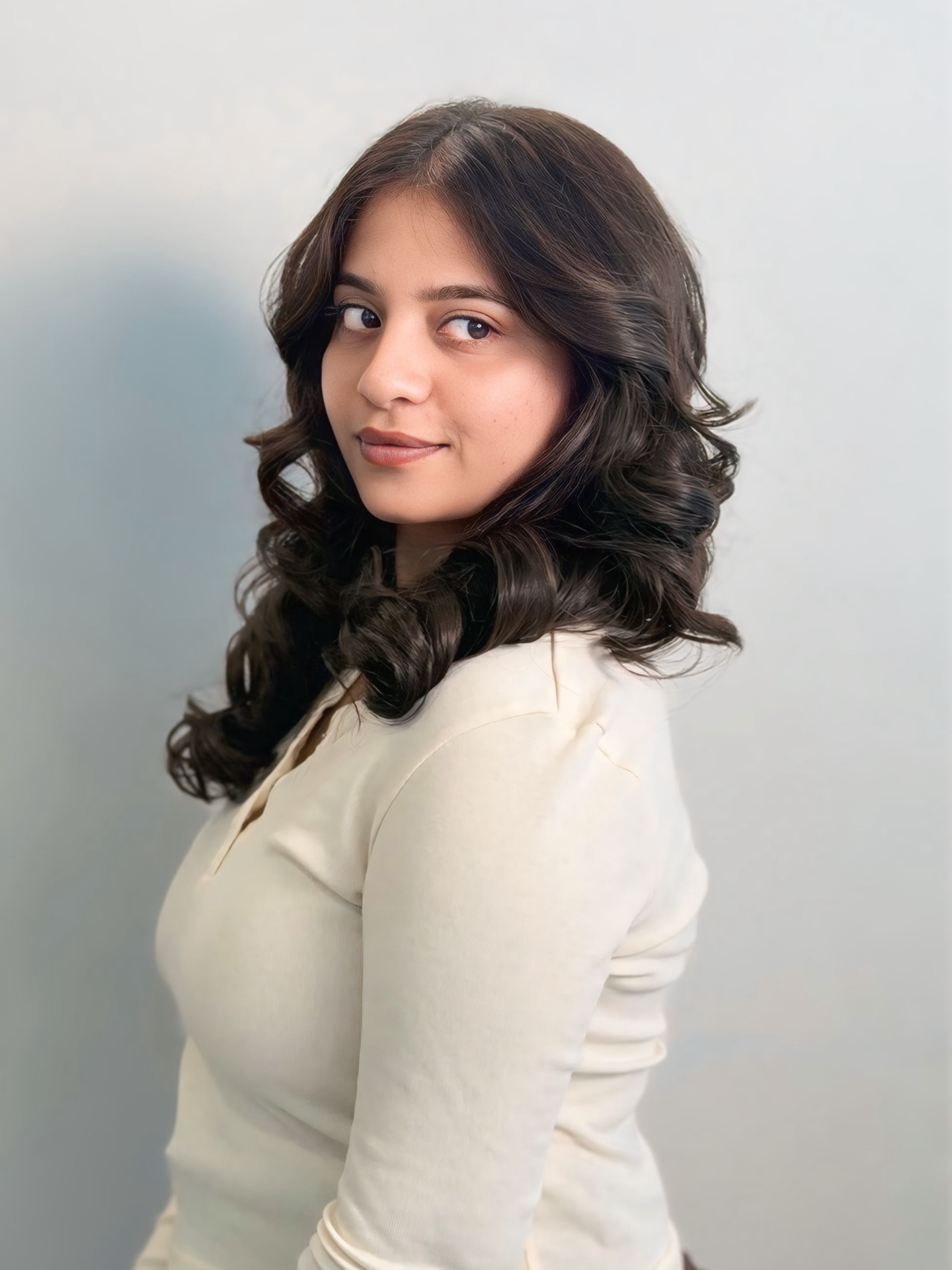 Soft Face-Framing Layered Curls with Center Part and Root Lift