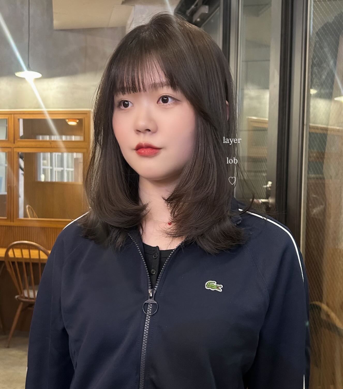 Soft Layered Mid-Lob with Wispy Micro-Bangs and Outward Flicks