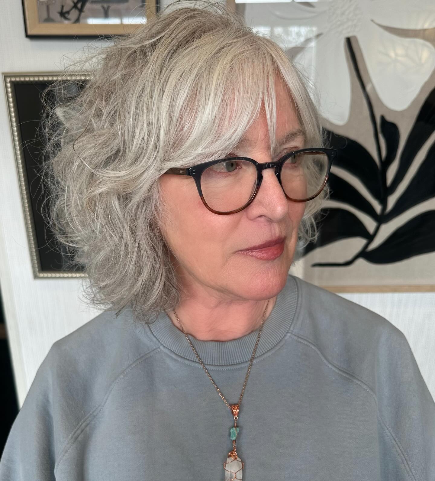 Soft Silver Shoulder-Length Shag with Wispy Side-Swept Fringe
