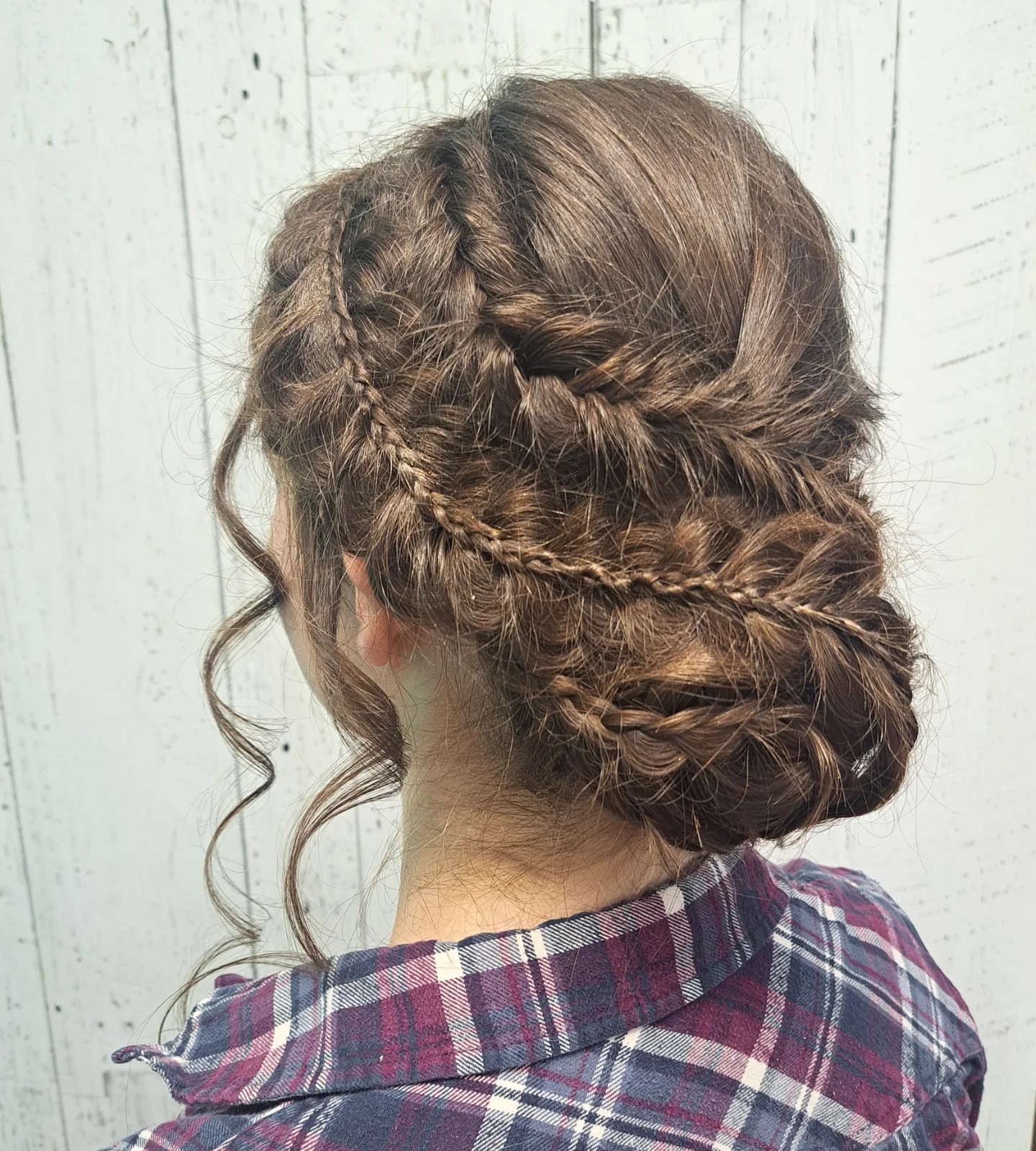 Soft Twisted Braided Low Bun with Loose Face-Framing Curls