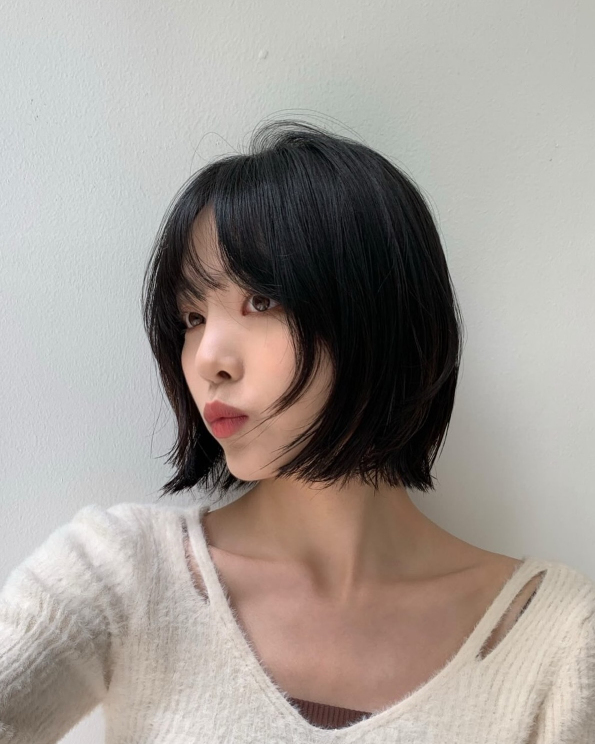 Textured Chin-Length Bob with Wispy Curtain Bangs