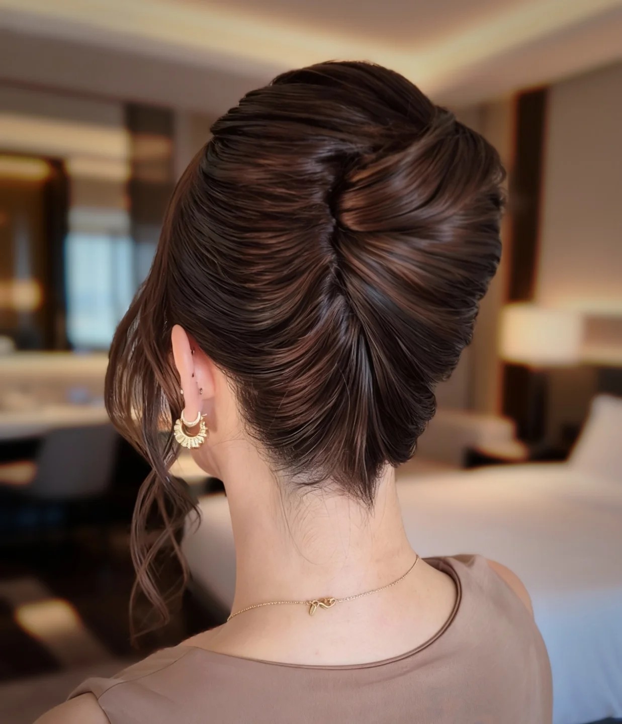 Textured French Roll with Tapered Nape and Face‑Framing Tendril
