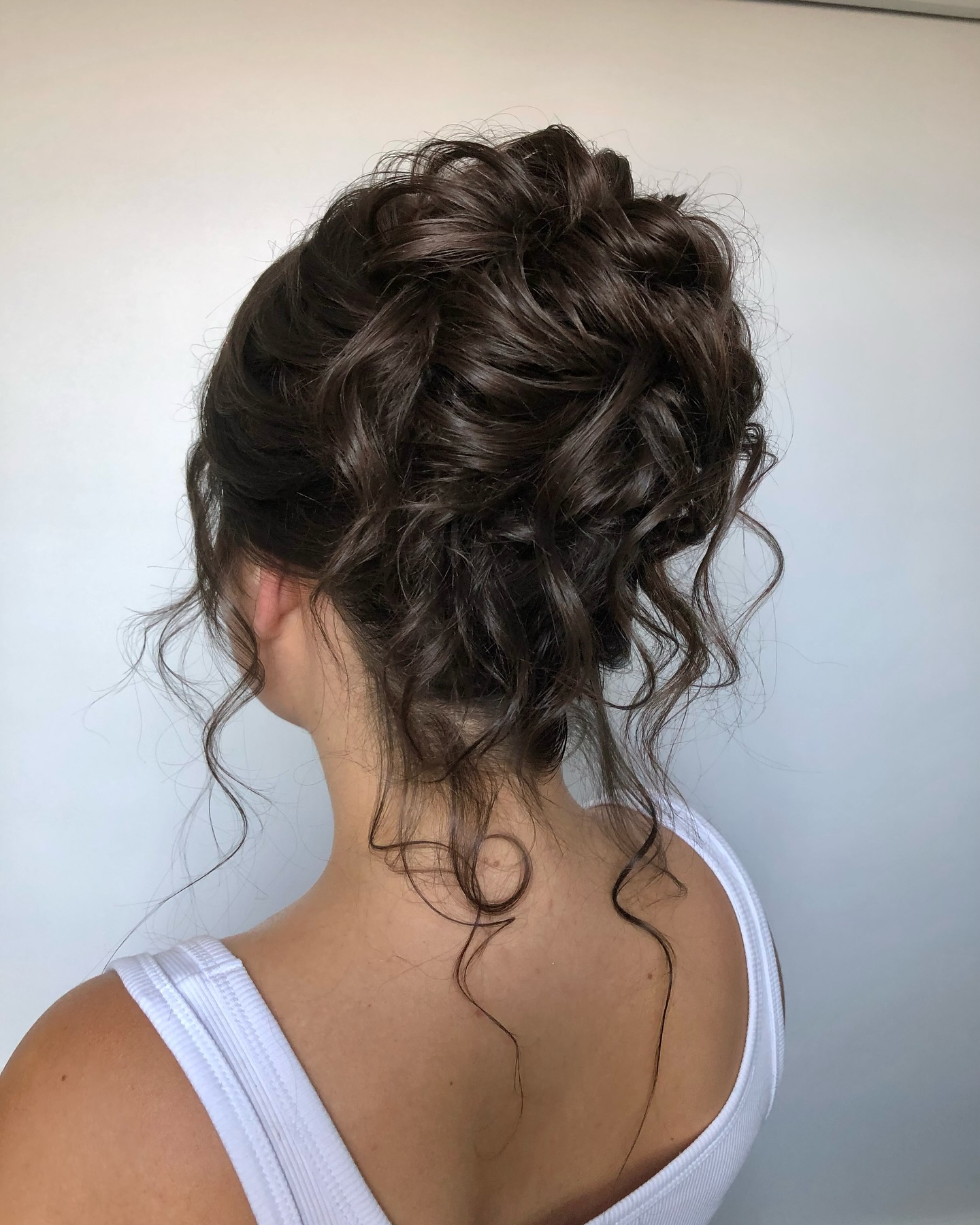 Textured Romantic Updo with Loose Nape Tendrils