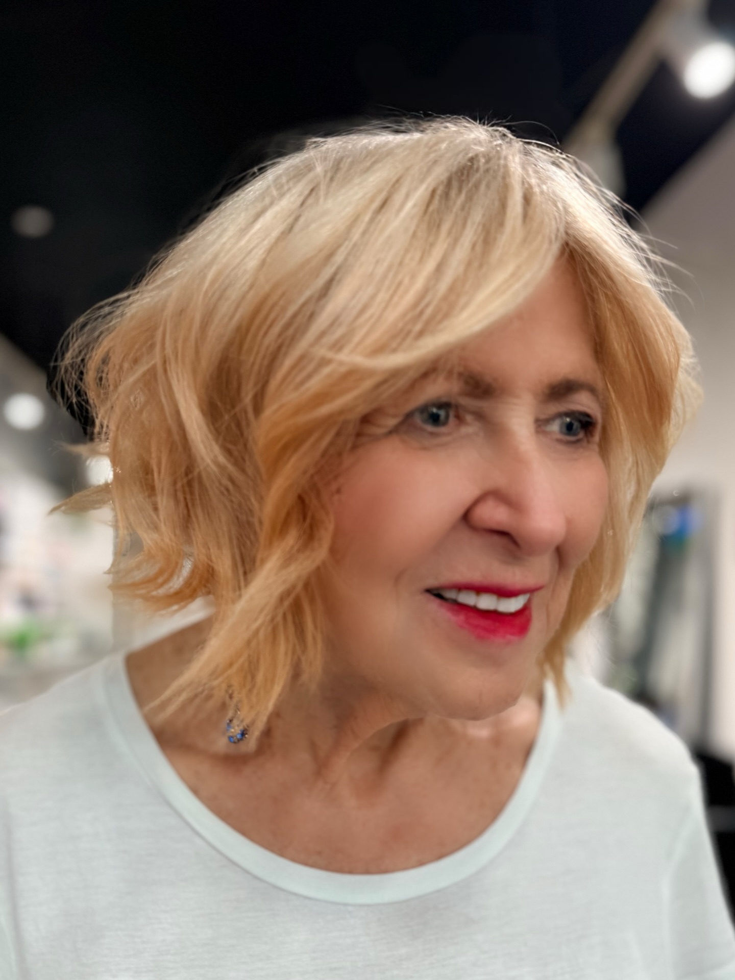 Textured Short Blonde Layered Bob with Side-Swept Fringe