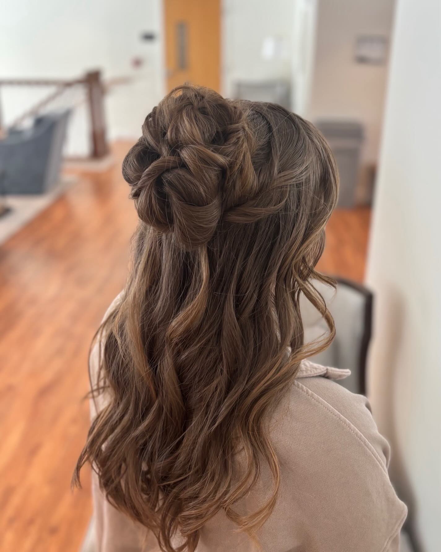 Twisted Rope Half-Up Floral Knot on Long Wavy Brown Hair