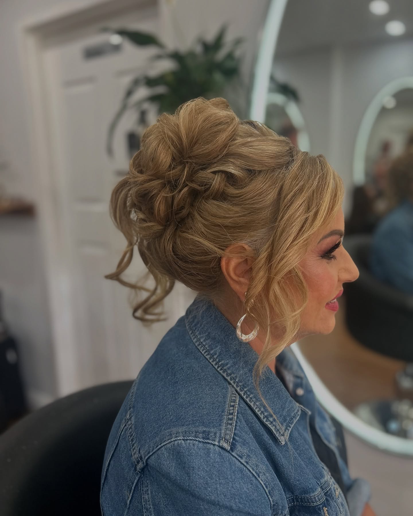Voluminous Twisted Chignon with Face-Framing Tendrils