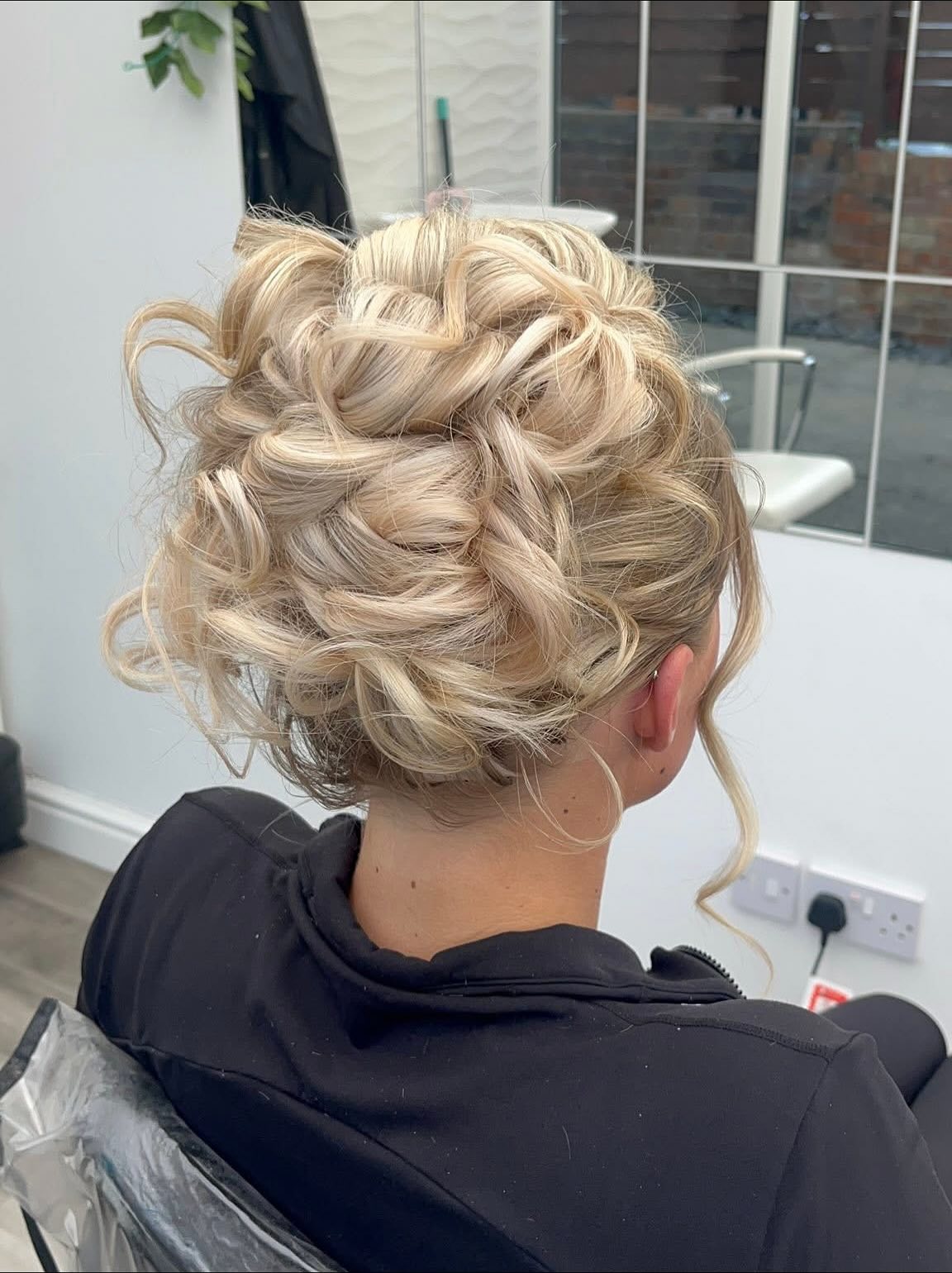 Warm Blonde Pinned Curl Updo with Loose Face Tendril