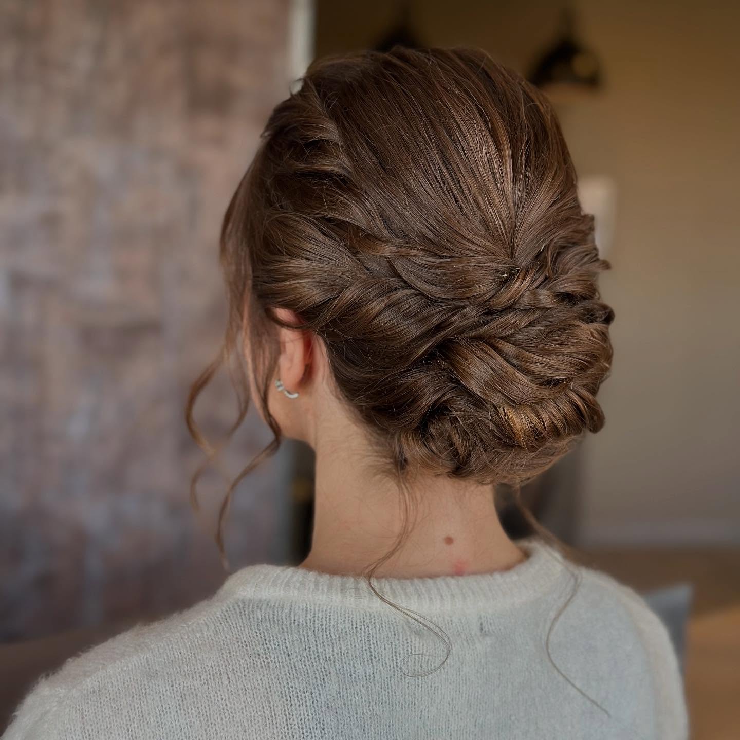 Woven Low Twist Chignon with Soft Face-Framing Strands