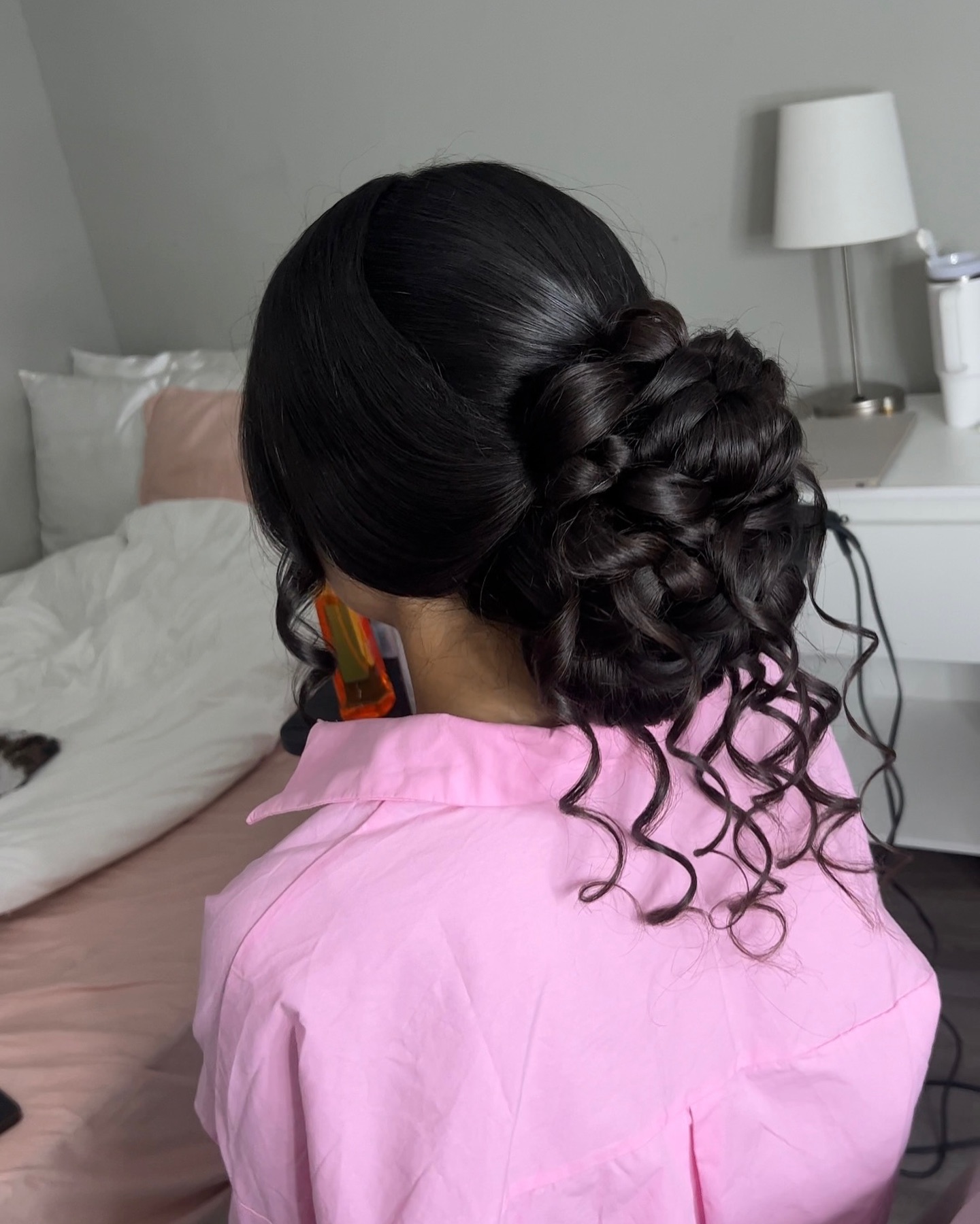 Wrapped Low Braided Floral Bun with Spiral Tendrils
