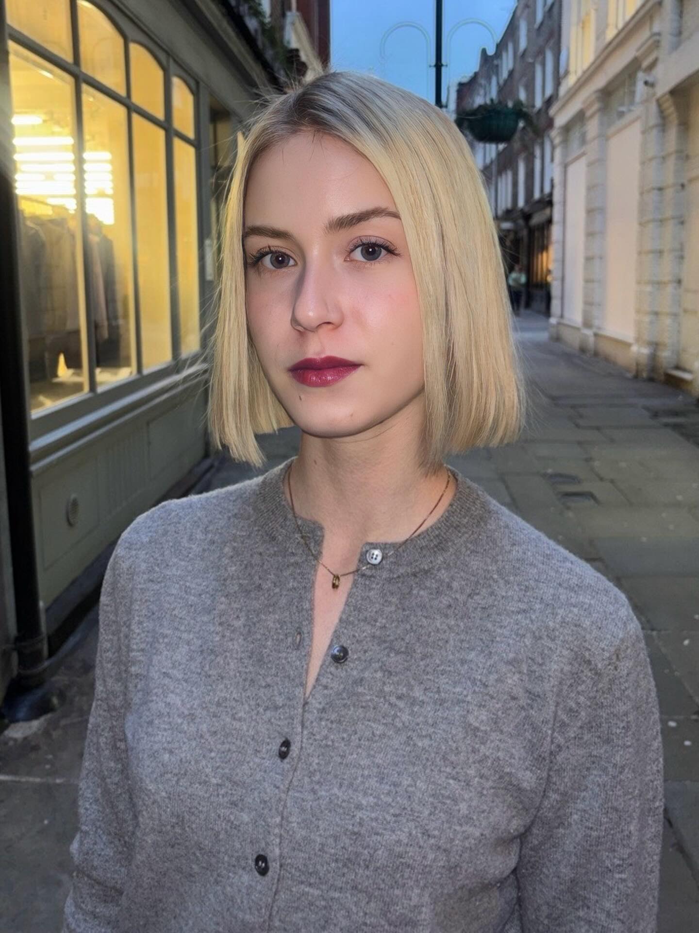 Blunt Chin-Length Ash Blonde Bob with Subtle Root Depth