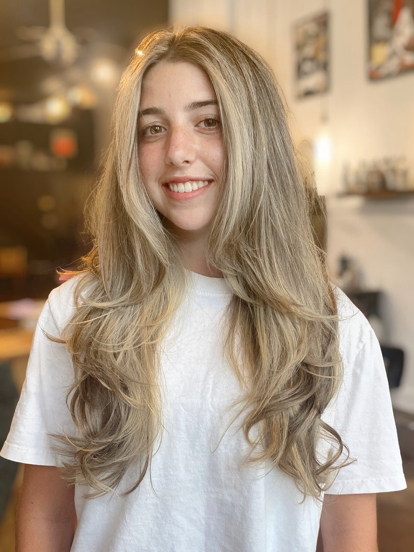 Brushed-Out Long Blonde Layers with Root Shadow and Soft Face Sweep