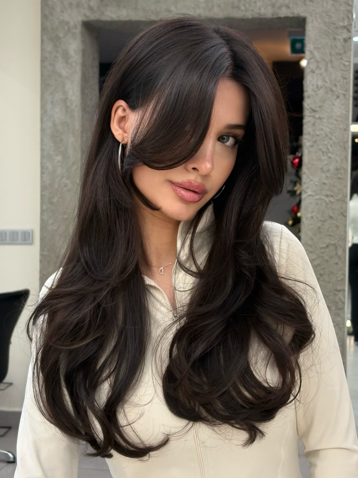 Deep Center-Split Long Layers with Sculpted Face-Framing Swoop