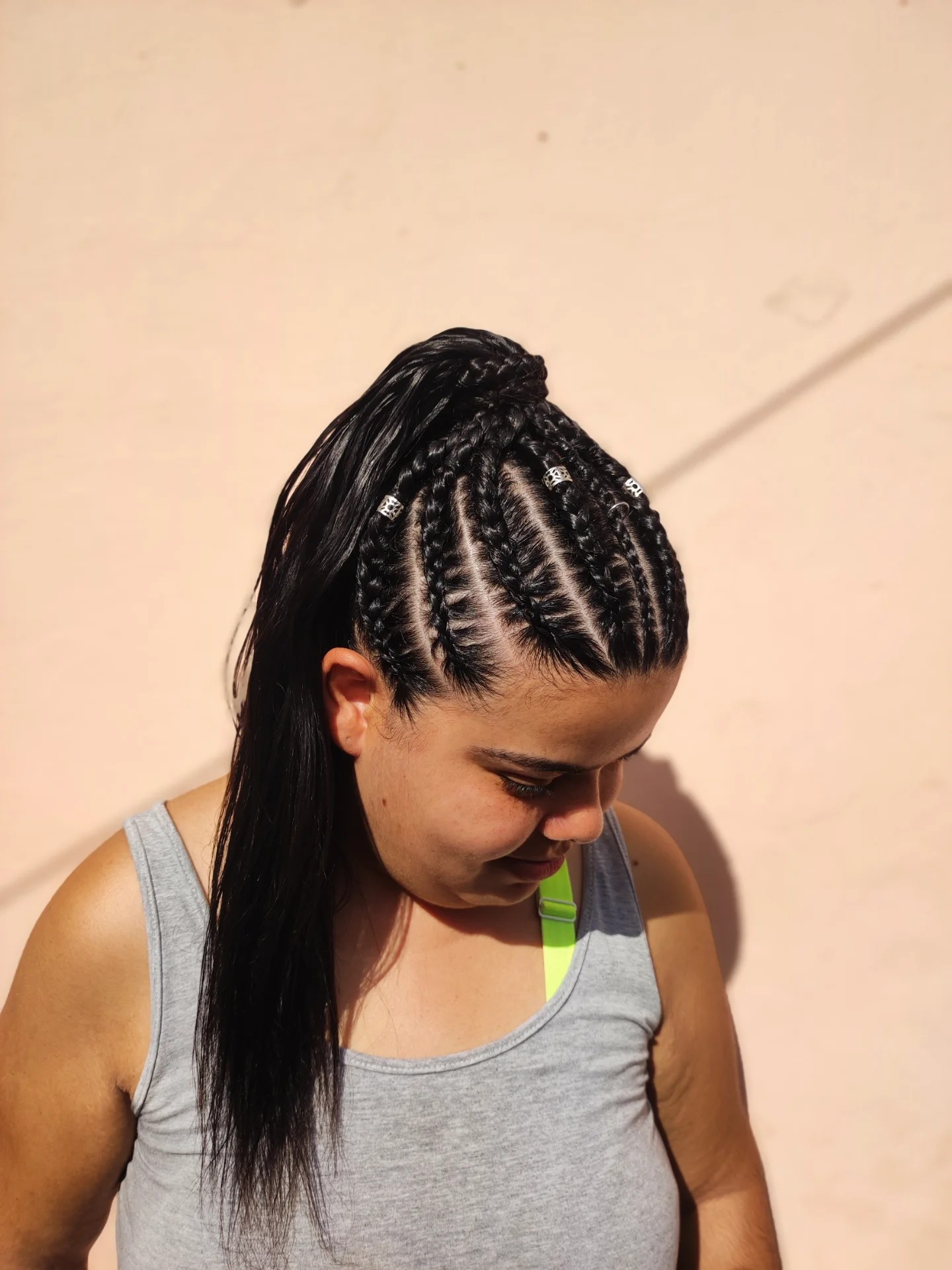 Defined Cornrow High Pony with Straight Tail and Metal Cuffs