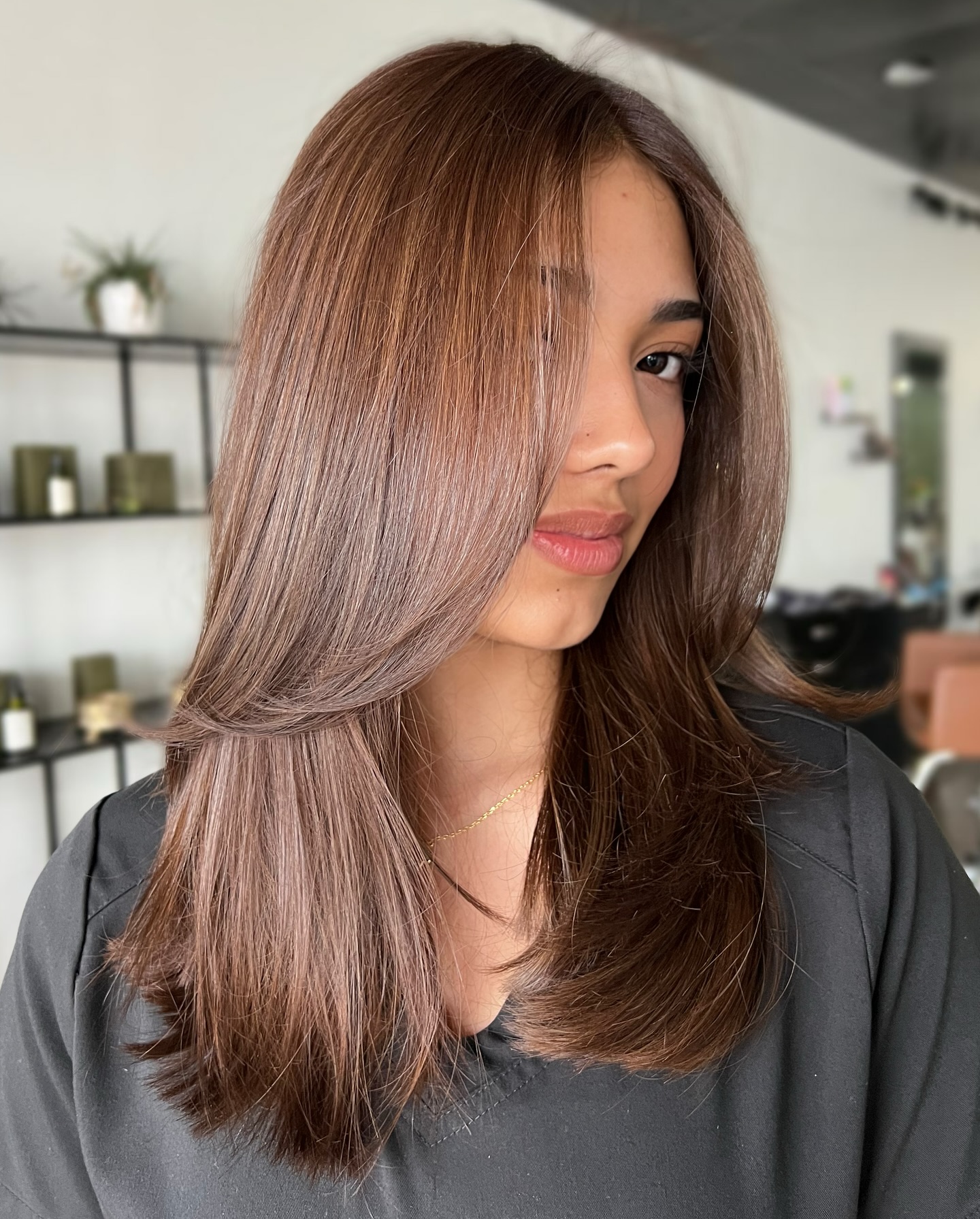 Glossy Mid-Length Caramel-Infused Layers with Blended Face-Framing Slices
