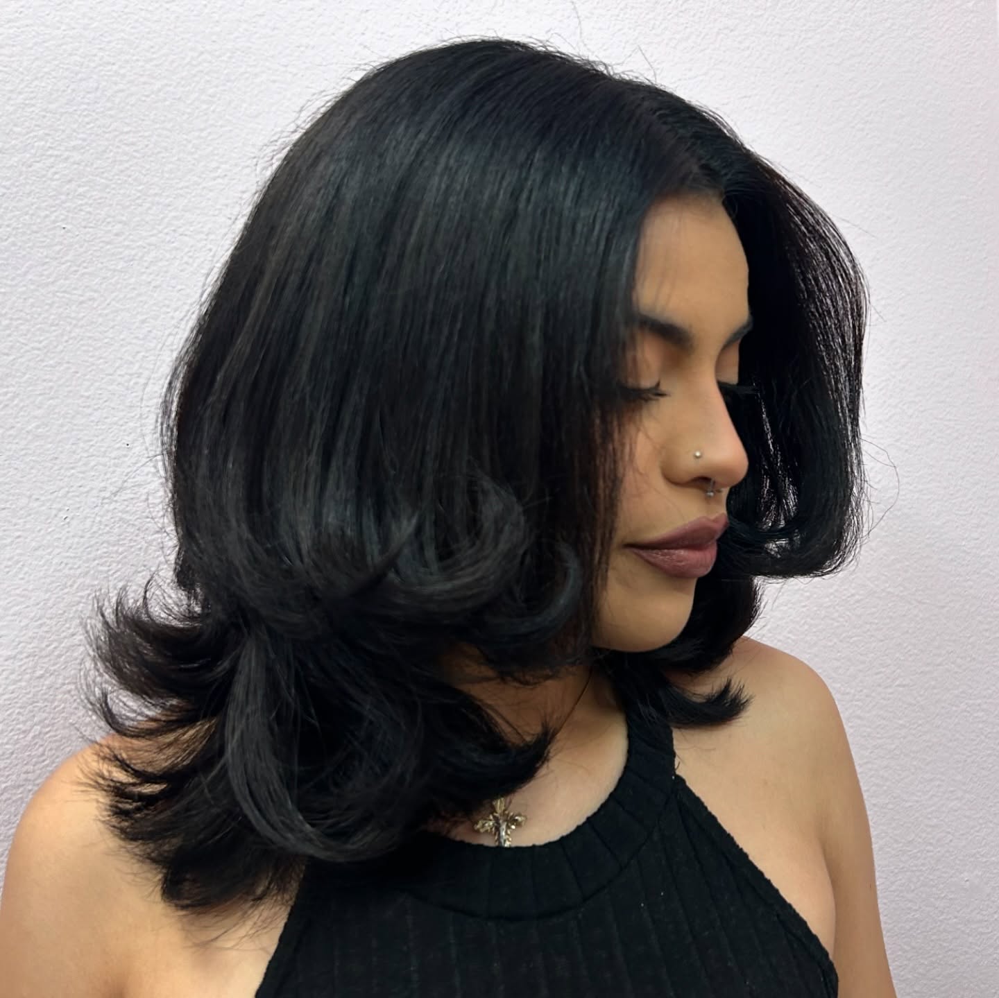 Glossy Shoulder-Length Flip Cut with Interior Feathering