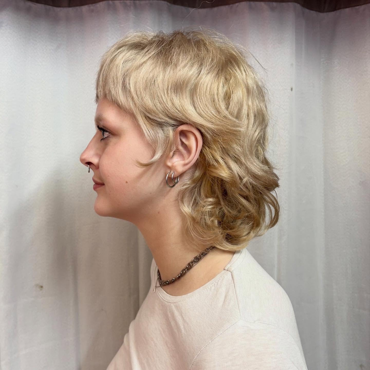 Platinum Shag Mullet with Micro Bangs and Soft Nape Curls