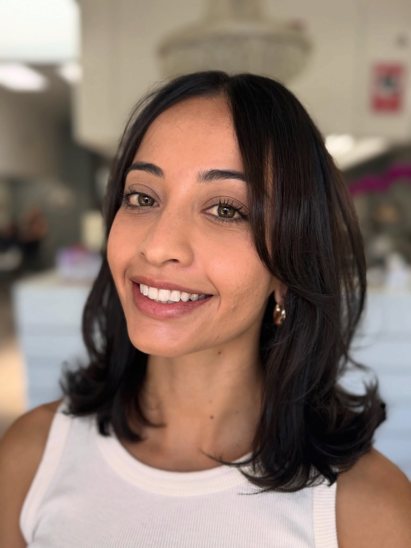 Shoulder-Length Radial Layers with Subtle Face-Framing Curtain