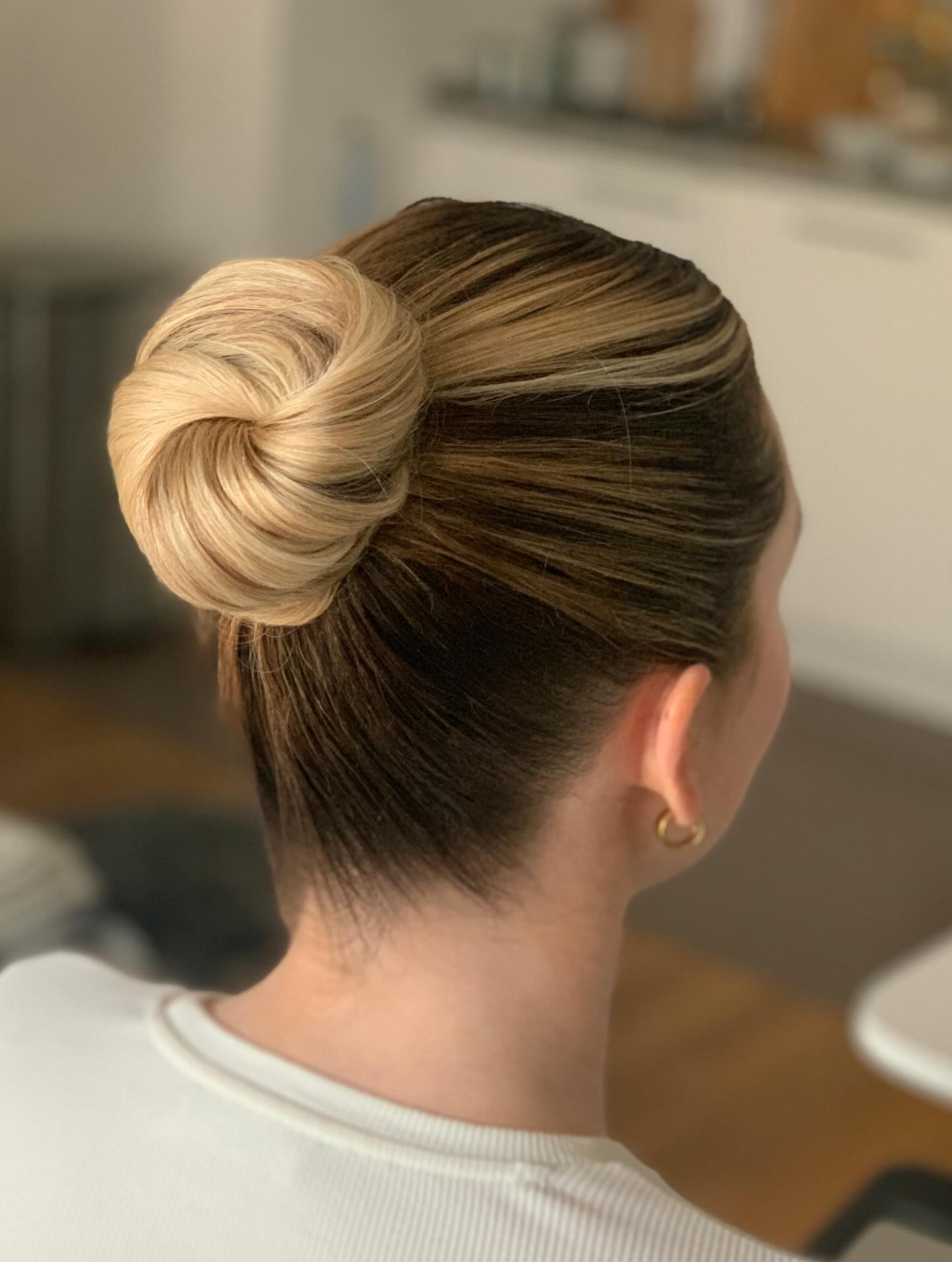 Sleek Donut Bun with Radial Blonde Highlights