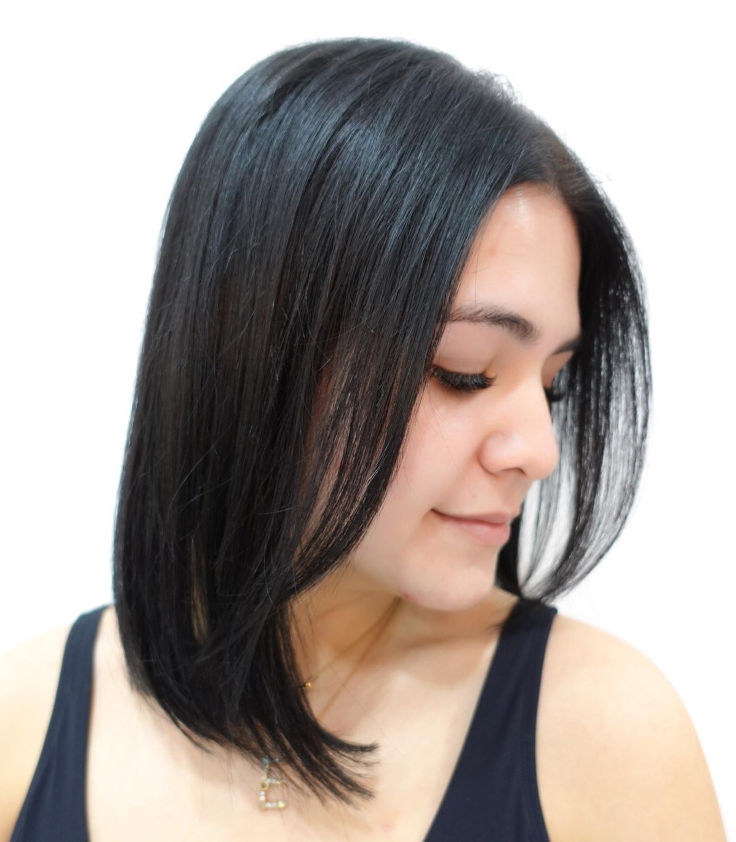 Sleek Jet-Black Angled Blunt Lob with Subtle Interior Point-Cutting