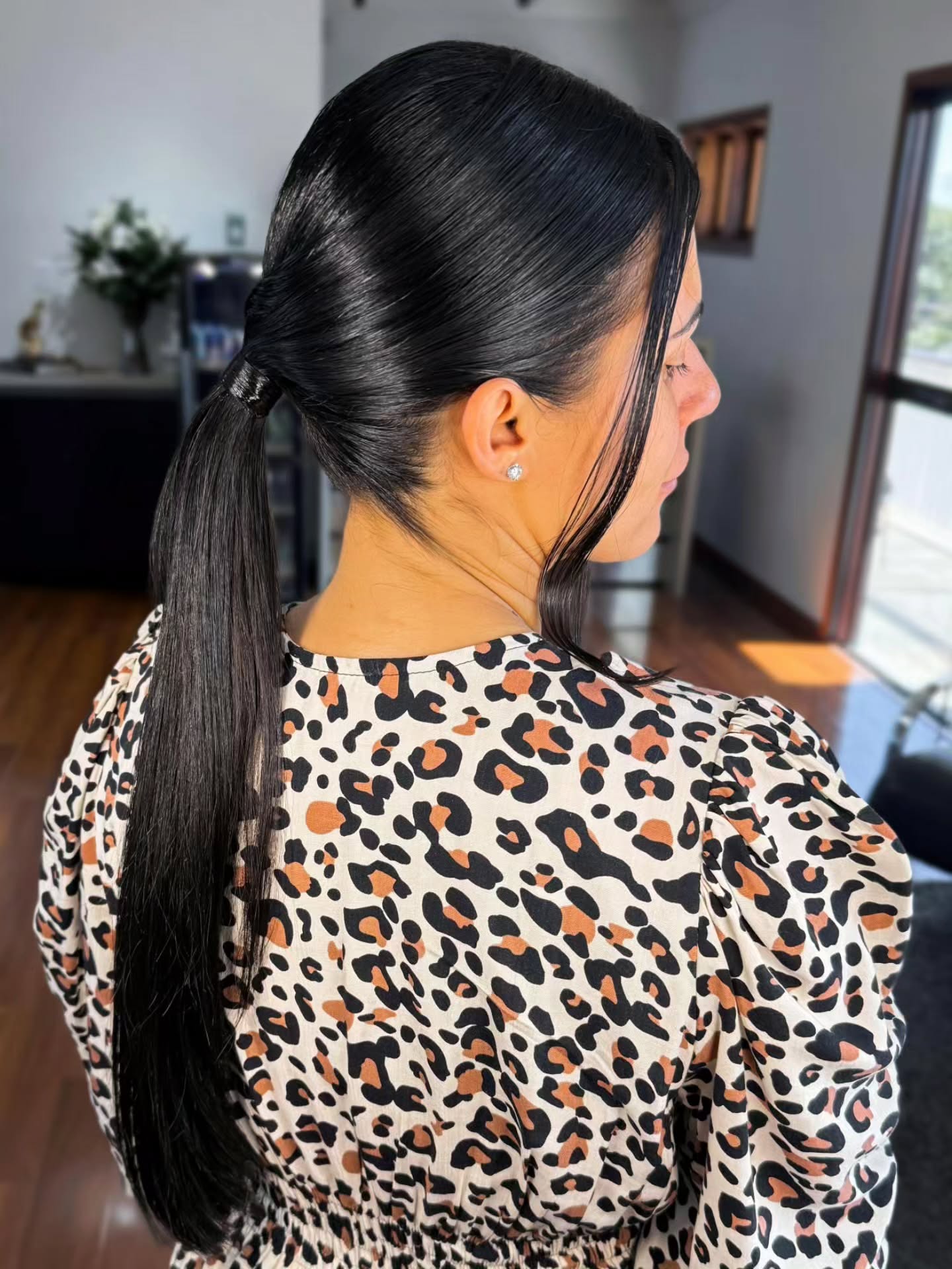 Sleek Jet-Black Low Wrapped Ponytail with Tucked Nape