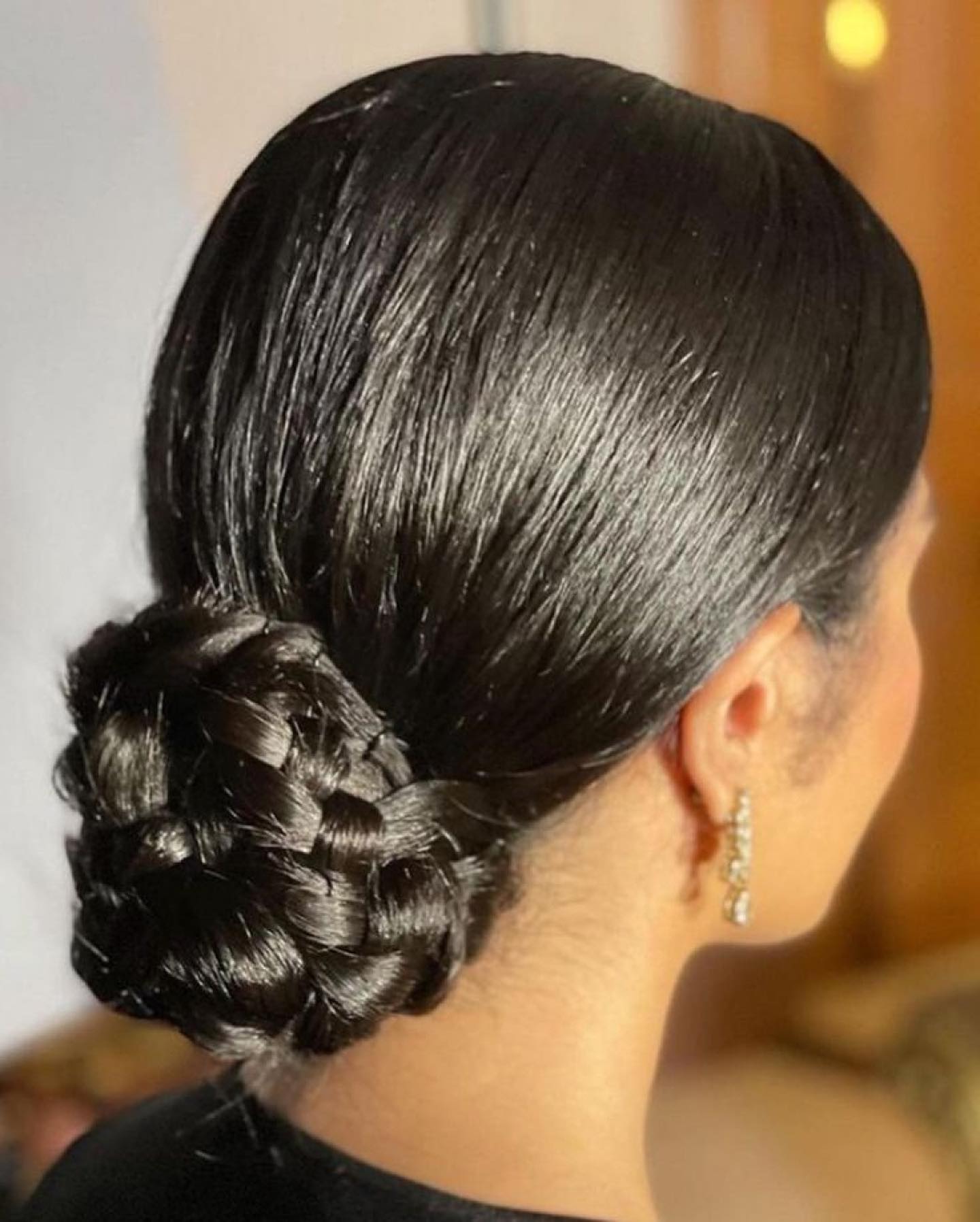 Sleek Low Braided Donut Chignon