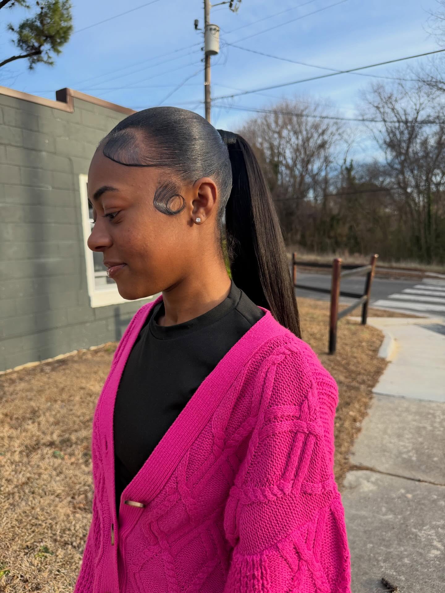 Sleek Mid-High Pony with Sculpted Ear-Loop Swirl